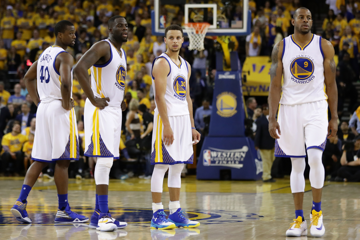 Golden State Warriors players Harrison Barnes, Draymond Green, Stephen Curry, and Andre Iguodala.