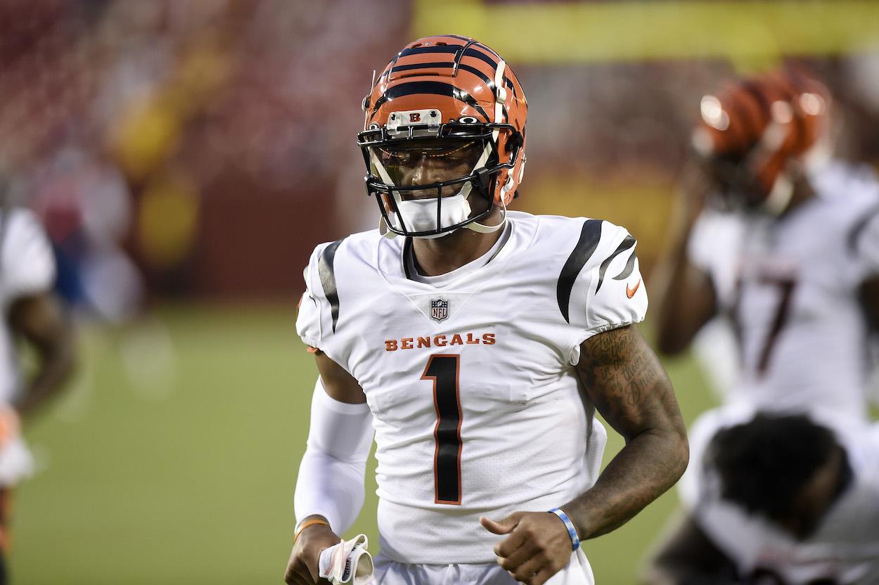 Ja'Marr Chase of the Cincinnati Bengals runs onto the field before the NFL preseason game against the Washington Football Team at FedExField on August 20, 2021 in Landover, Maryland.