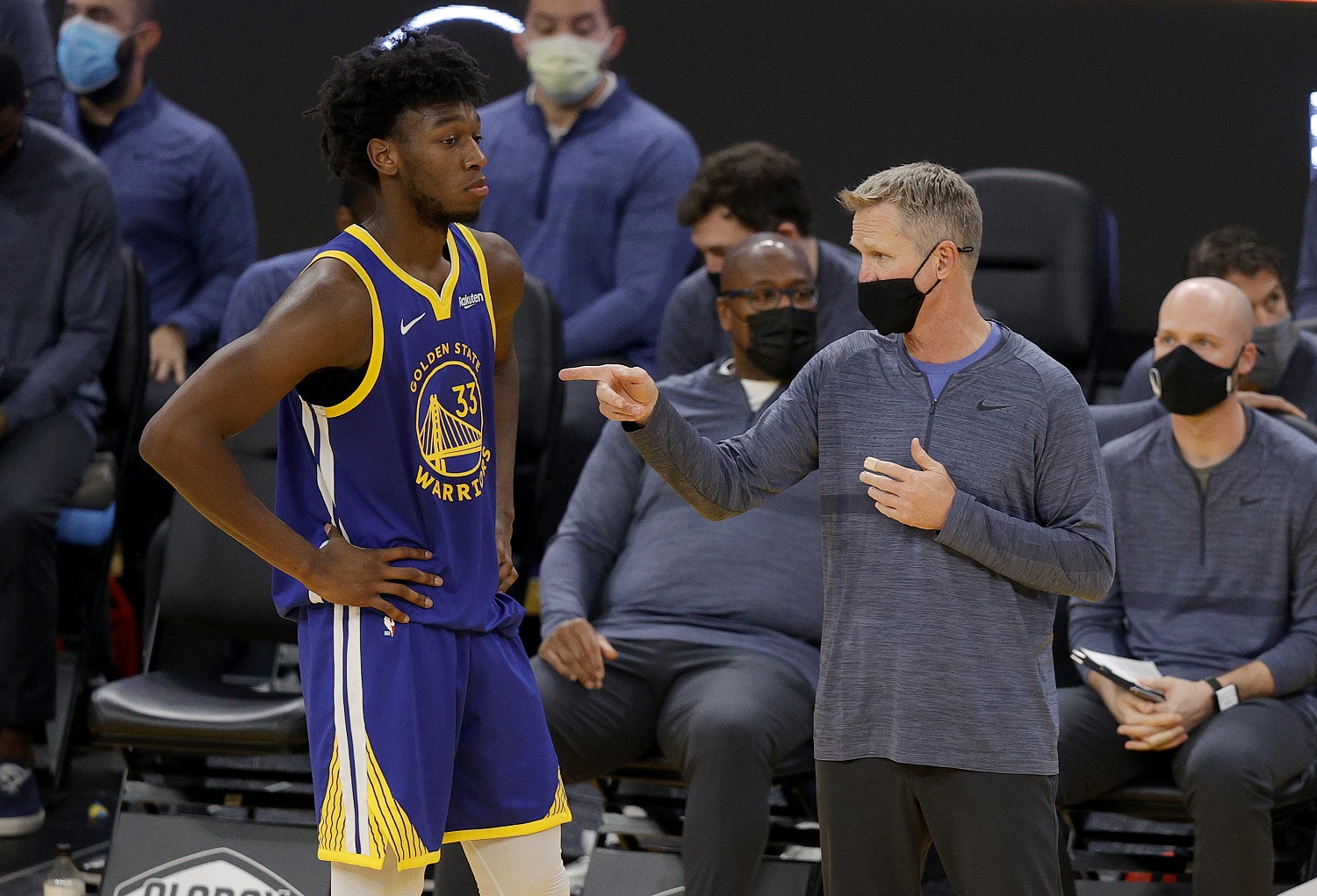 Golden State coach Steve Kerr speaks to Warriors rookie James Wiseman after he picked up his fourth foul in the second period against the Indiana Pacers on Jan. 12, 2021, in San Francisco, | Ezra Shaw/Getty Images