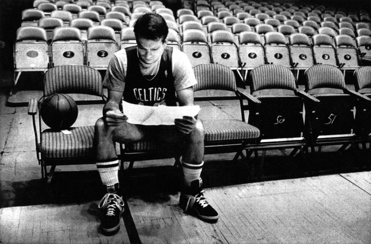 Jerry Sichting goes over some paperwork during practice at the 1987 NBA Finals.