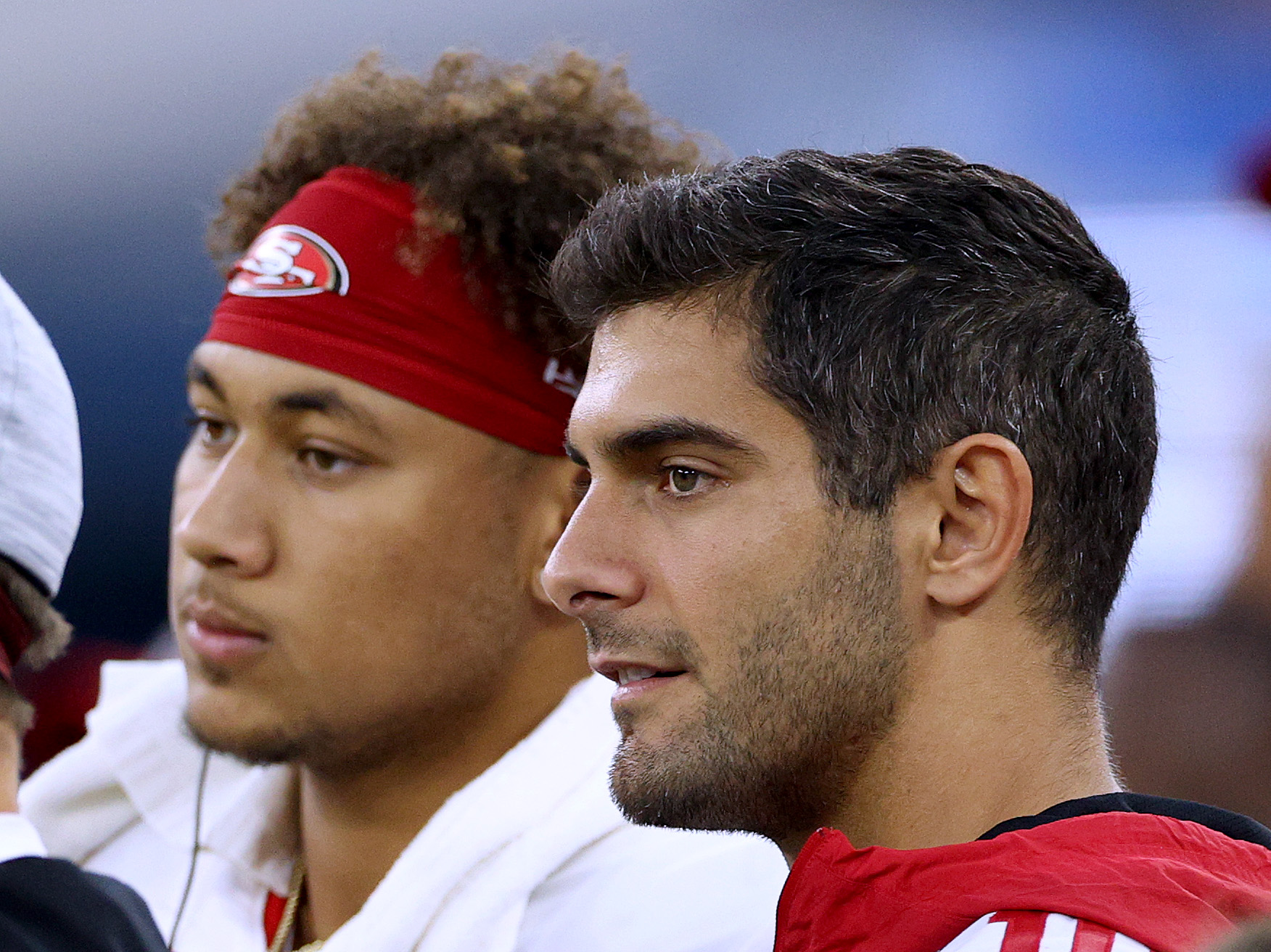Jimmy Garoppolo and Trey Lance watch the San Francisco 49ers preseason game on Sunday