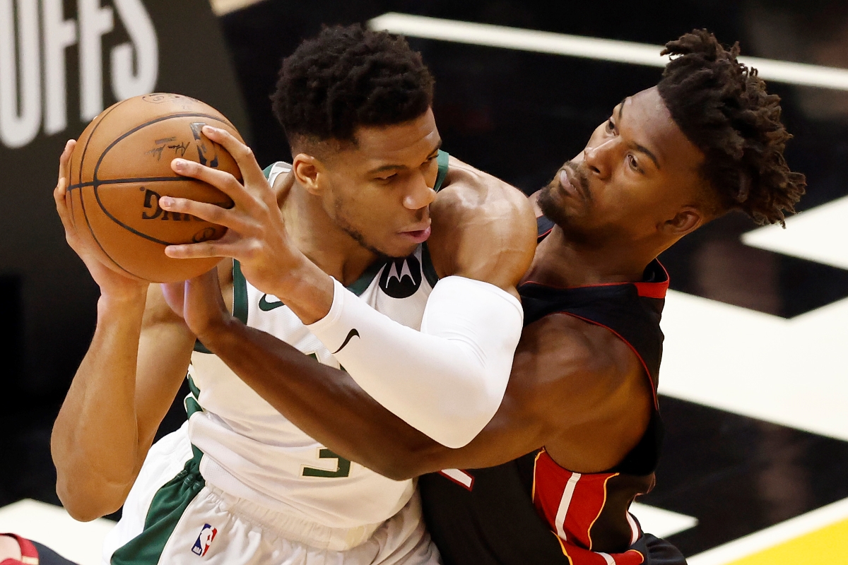The Miami Heat's Jimmy Butler guards the Milwaukee Bucks' Giannis Antetokounmpo.