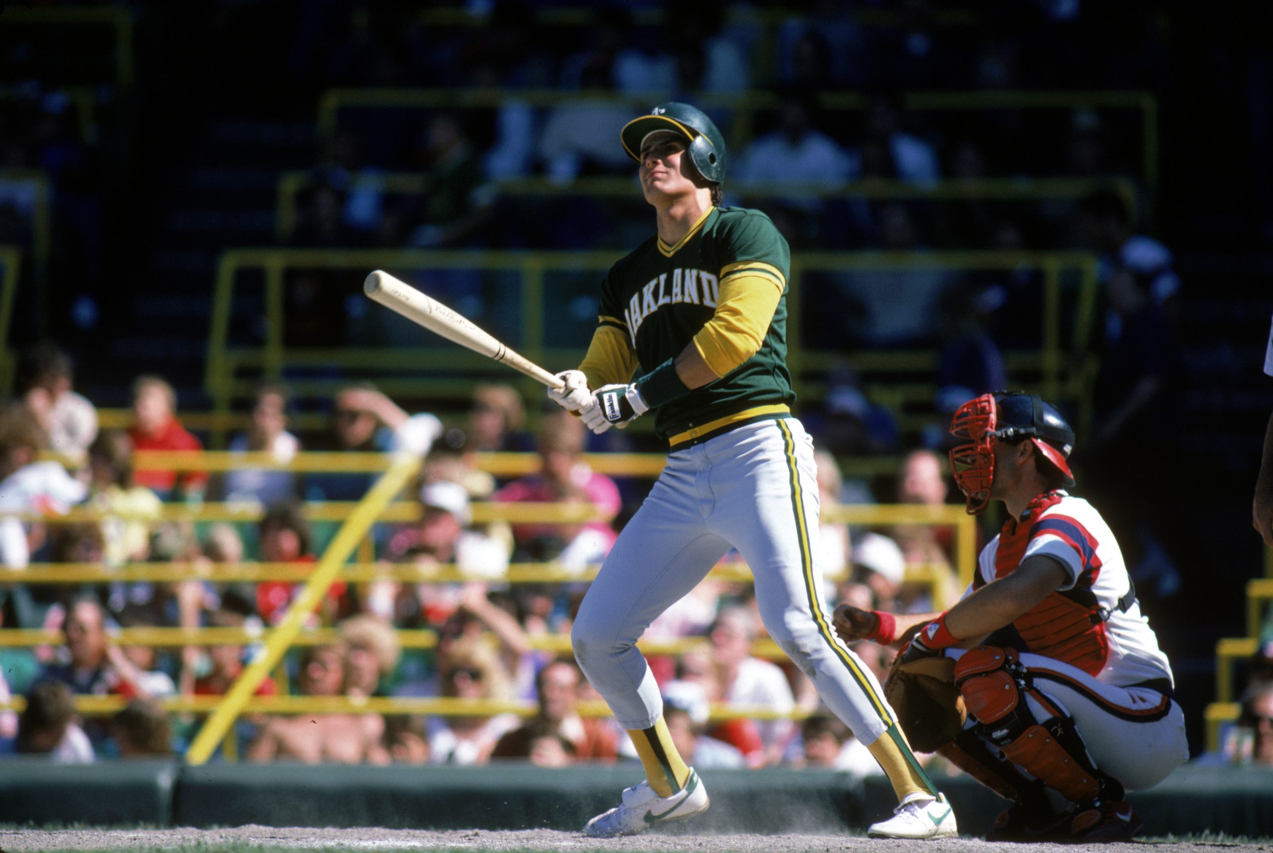 ose Canseco of the Oakland Athletics bats during an MLB game at Comiskey Park.