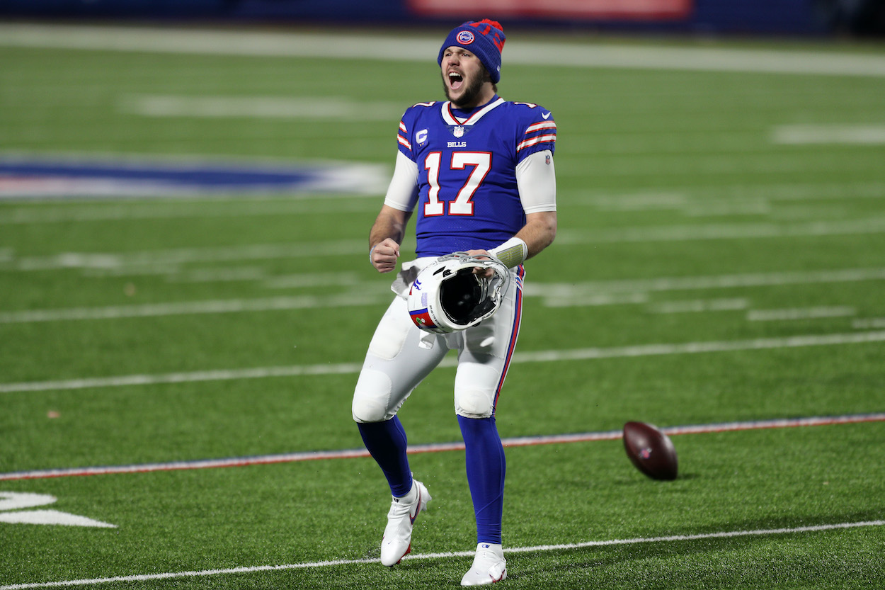 Josh Allen of the Buffalo Bills celebrates after defeating Lamar Jackson and the Baltimore Ravens during the AFC Divisional Playoff game at Bills Stadium on January 16, 2021 in Orchard Park, New York. The Bills defeated the Ravens 17-3.