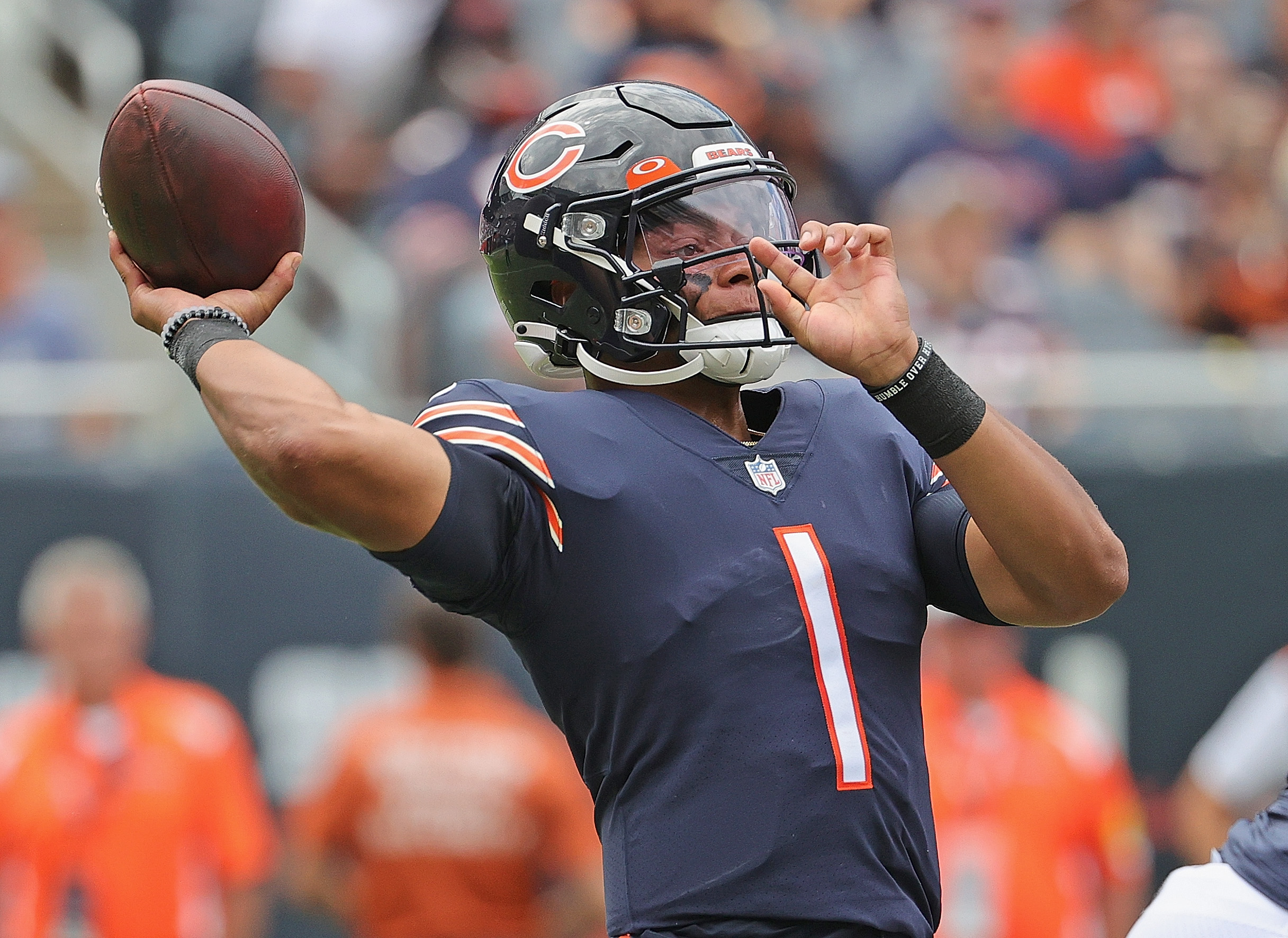 Justin Fields throws a pass during a Chicago Bears preseason game