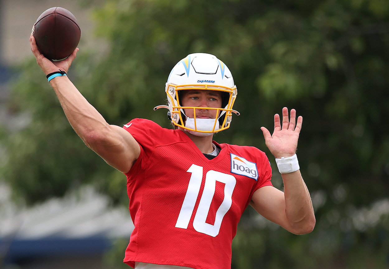 Justin Herbert of the Los Angeles Chargers throws the football during Los Angeles Chargers training camp at Jack Hammett Sports Complex on August 06, 2021 in Costa Mesa, California.