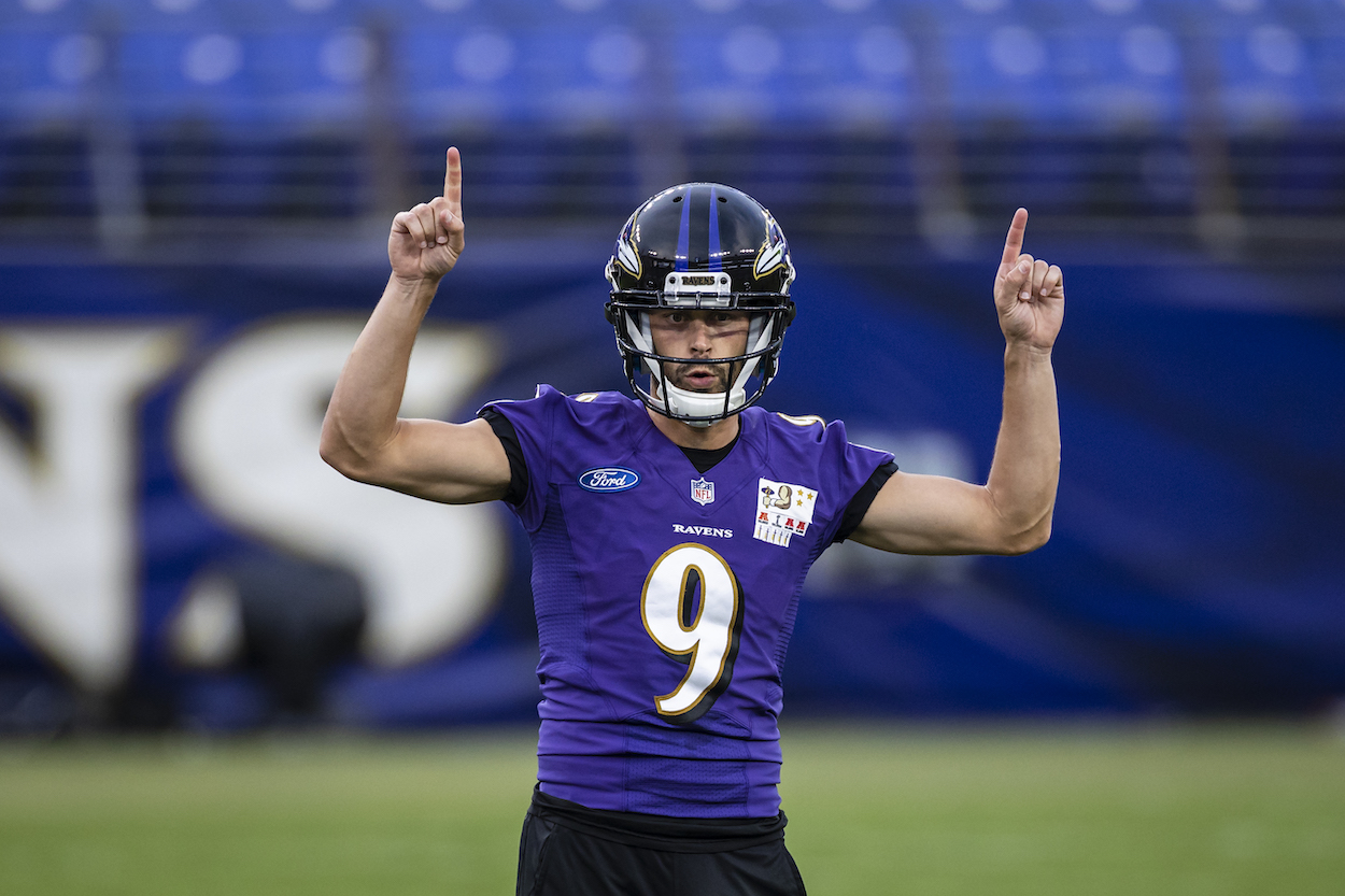 Justin Tucker of the Baltimore Ravens, the highest-paid kicker in the NFL, celebrates after kicking a field goal during training camp at M&T Bank Stadium on July 31, 2021 in Baltimore, Maryland.