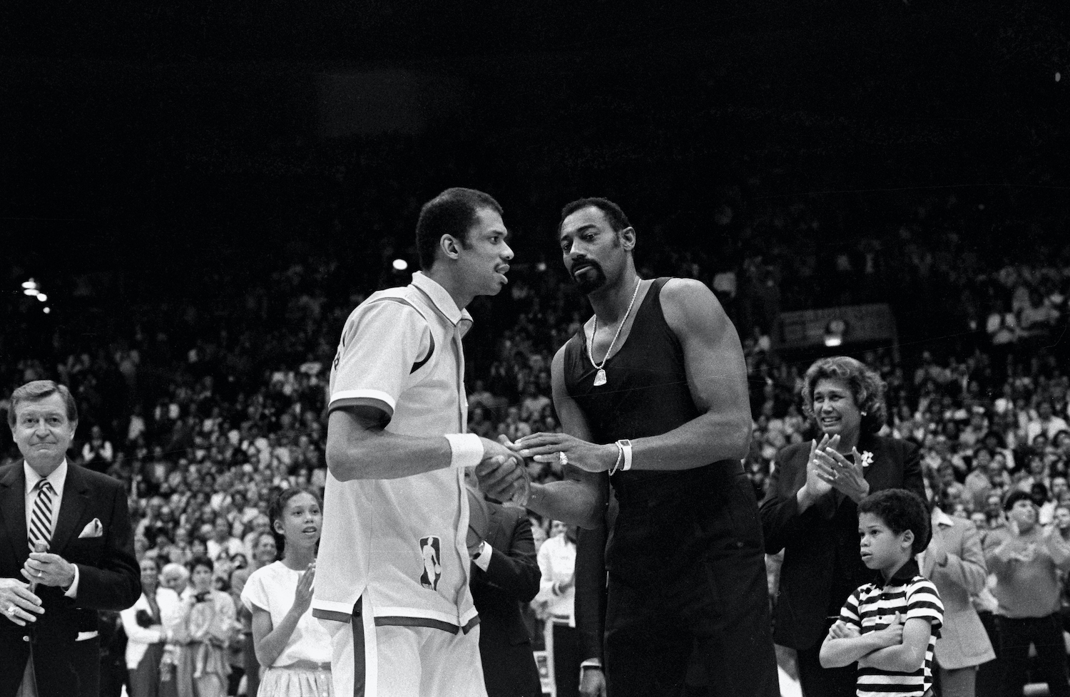 Wilt Chamberlain (R) and Kareem Abdul-Jabbar (L) exchange words ahead of a Los Angeles Lakers game.