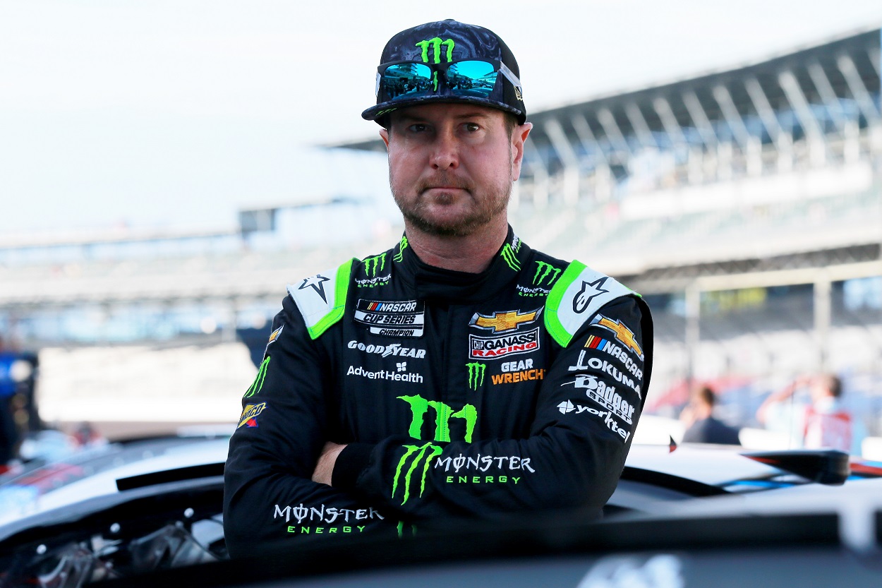 Kyle Busch waits on the grid area during qualifying for the NASCAR Cup Series Verizon 200 at the Brickyard at Indianapolis Motor Speedway