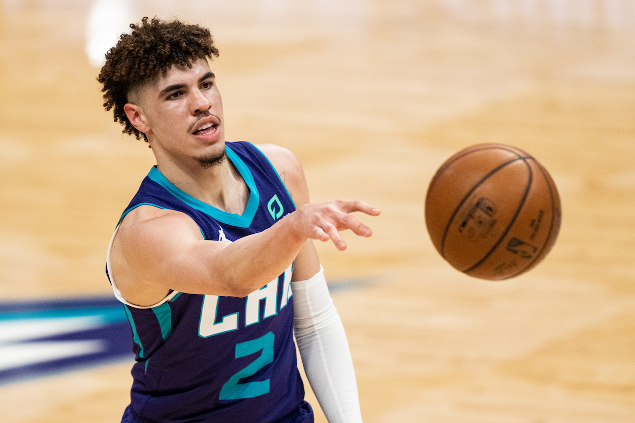 LaMelo Ball passes the ball against the Orlando Magic