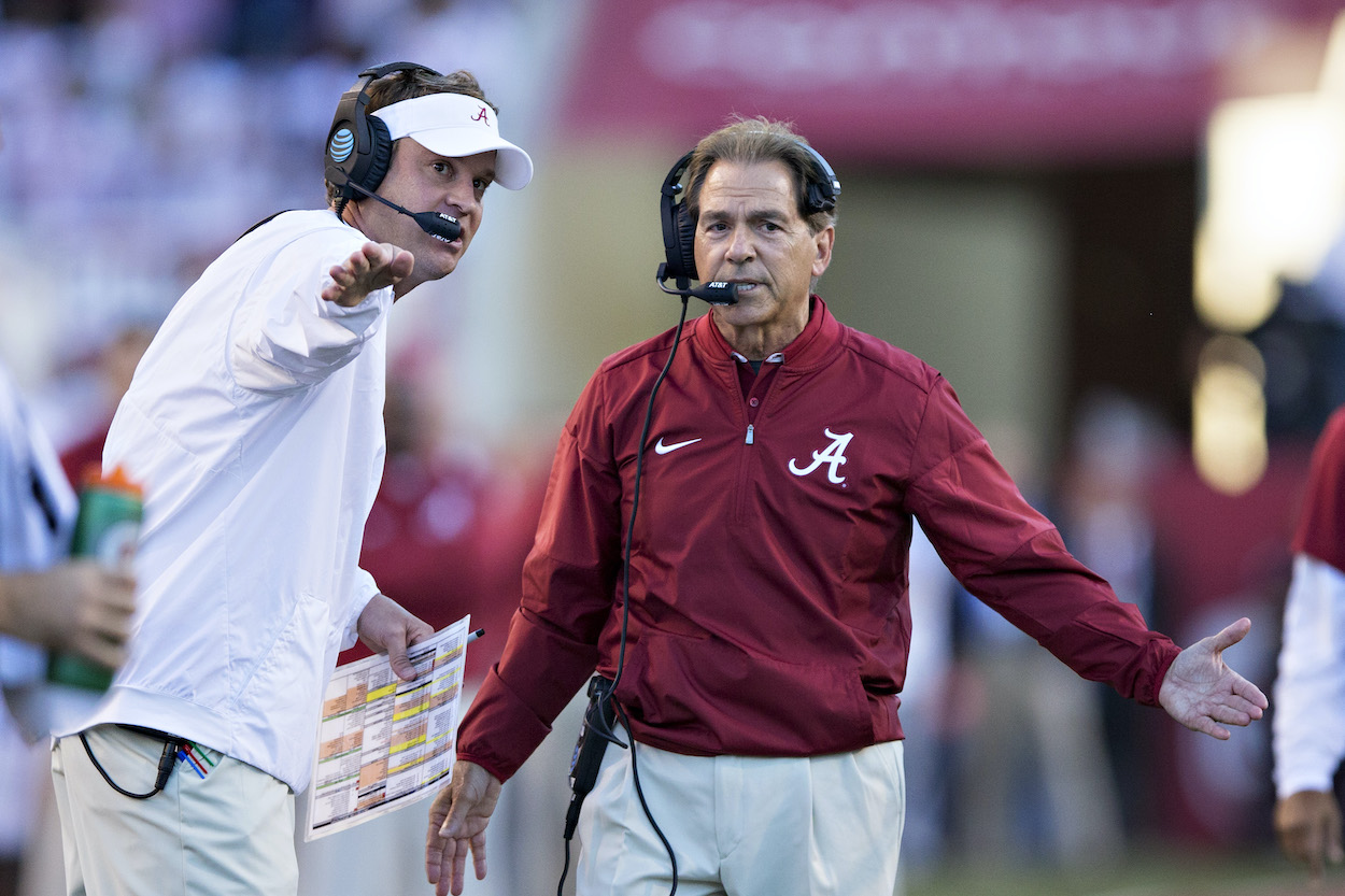 Head Coach Nick Saban and Offensive Coordinator (and current Ole Miss head coach) Lane Kiffin of the Alabama Crimson Tide discuss a call during a game against the Arkansas Razorbacks at Razorback Stadium on October 8, 2016 in Fayetteville, Arkansas.