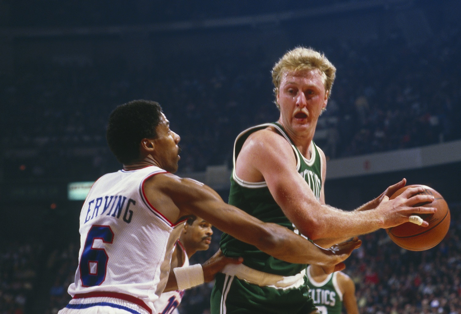 Philadelphia 76ers forward Julius Erving 6 defends against Boston Celtics' Larry Bird at The Spectrum circa 1990 in Philadelphia.
