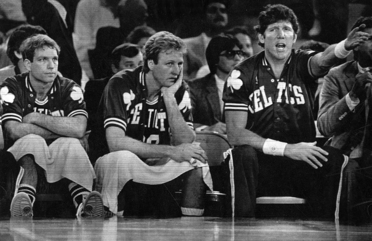 Boston Celtics' Jerry Sichting, Larry Bird and Bill Walton react from the bench.