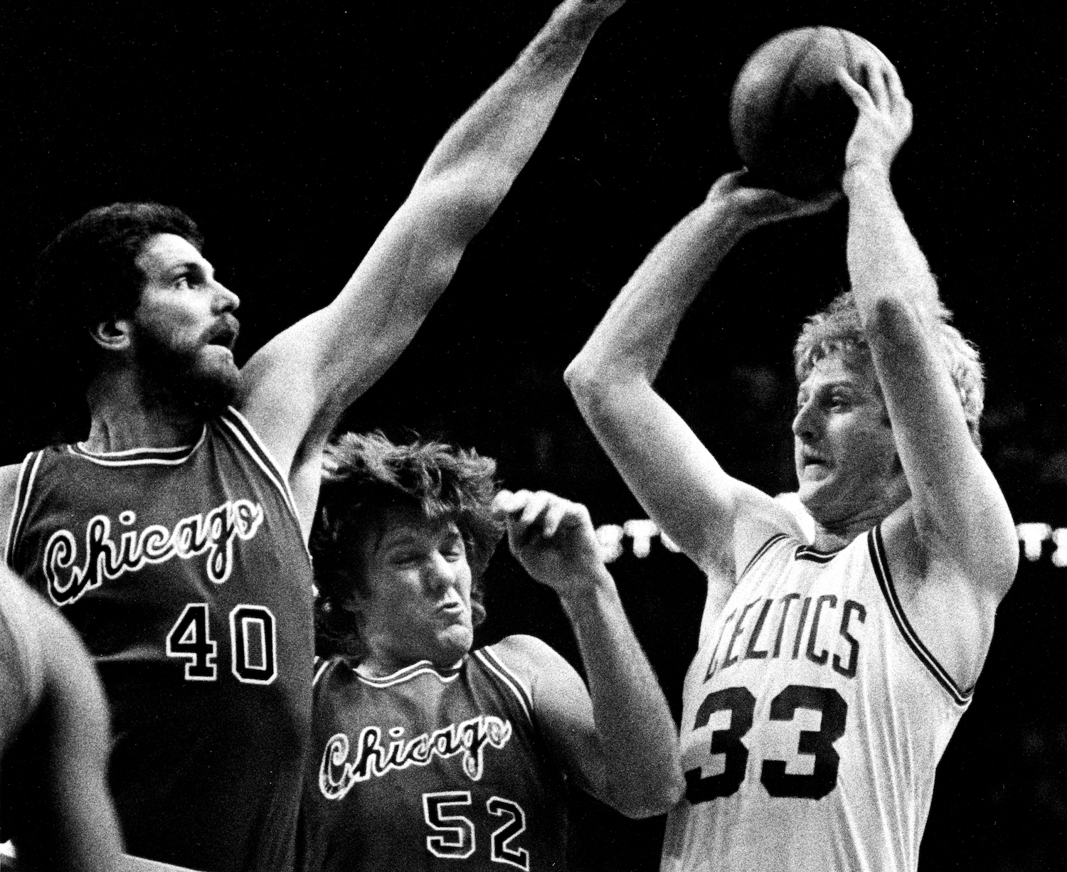 Boston Celtics star Larry Bird attempts a shot against the Chicago Bulls.