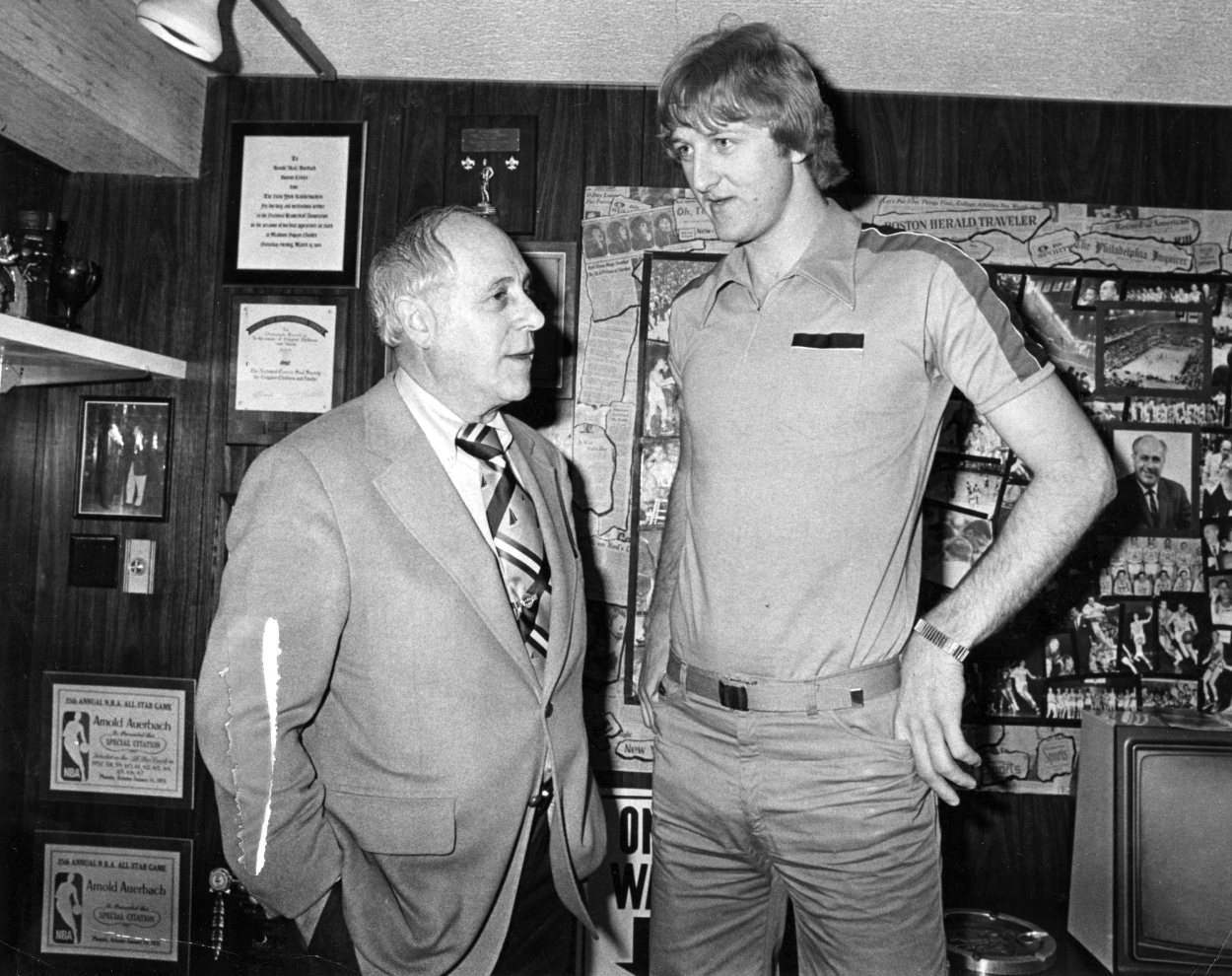 Boston Celtics general manager Red Auerbach, left, talks with Indiana State player Larry Bird.