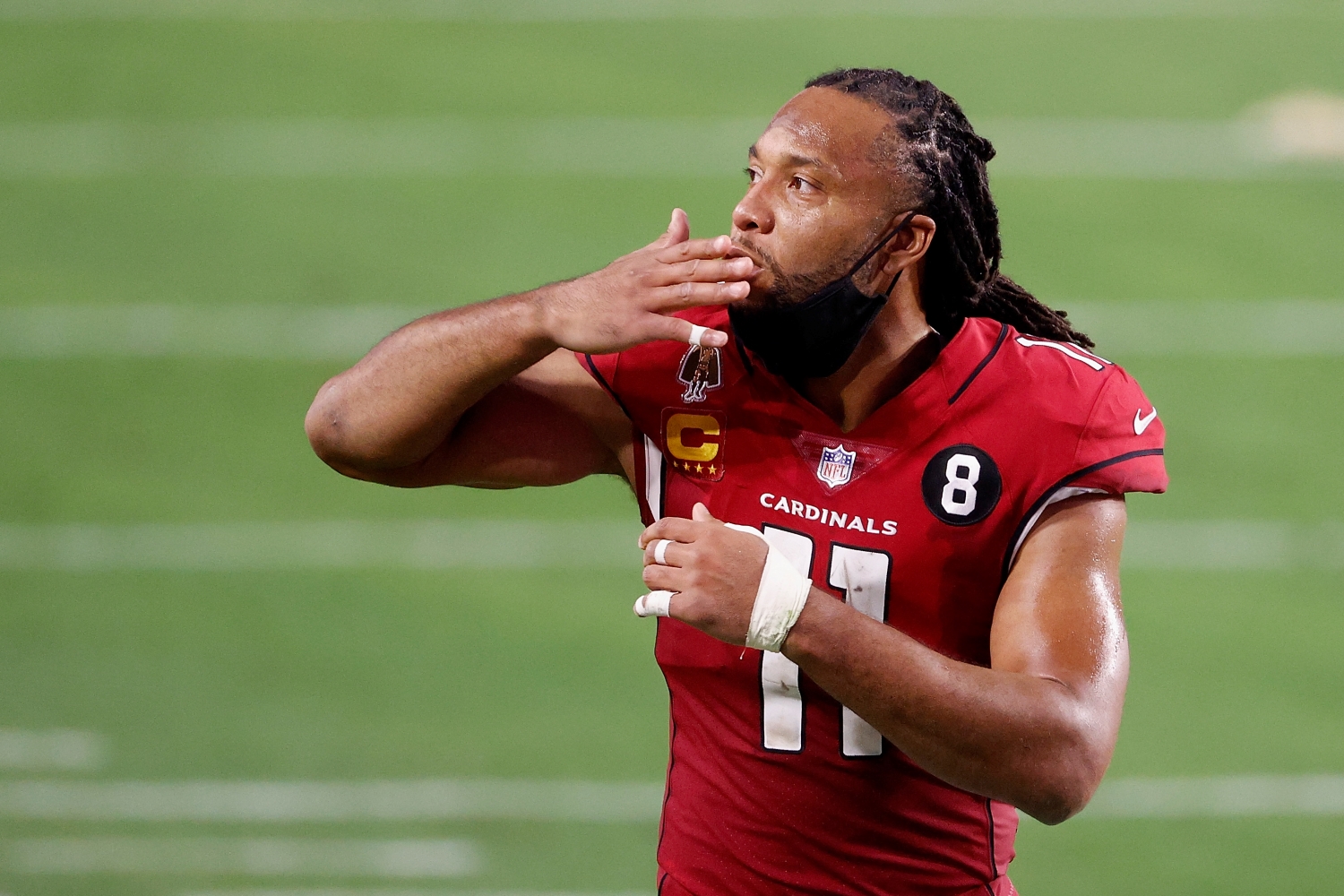 Arizona Cardinals wide receiver Larry Fitzgerald says goodbye to fans after a game against the San Francisco 49ers.