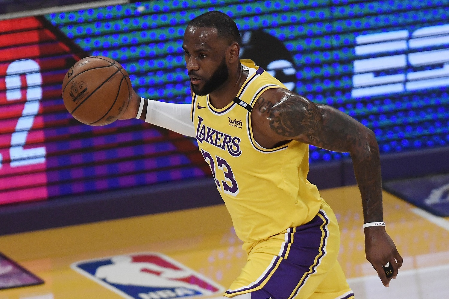 LeBron James of the Los Angeles Lakers dribbles during the first half of an NBA play-In game against the Golden State Warriors at Staples Center on May 19, 2021.