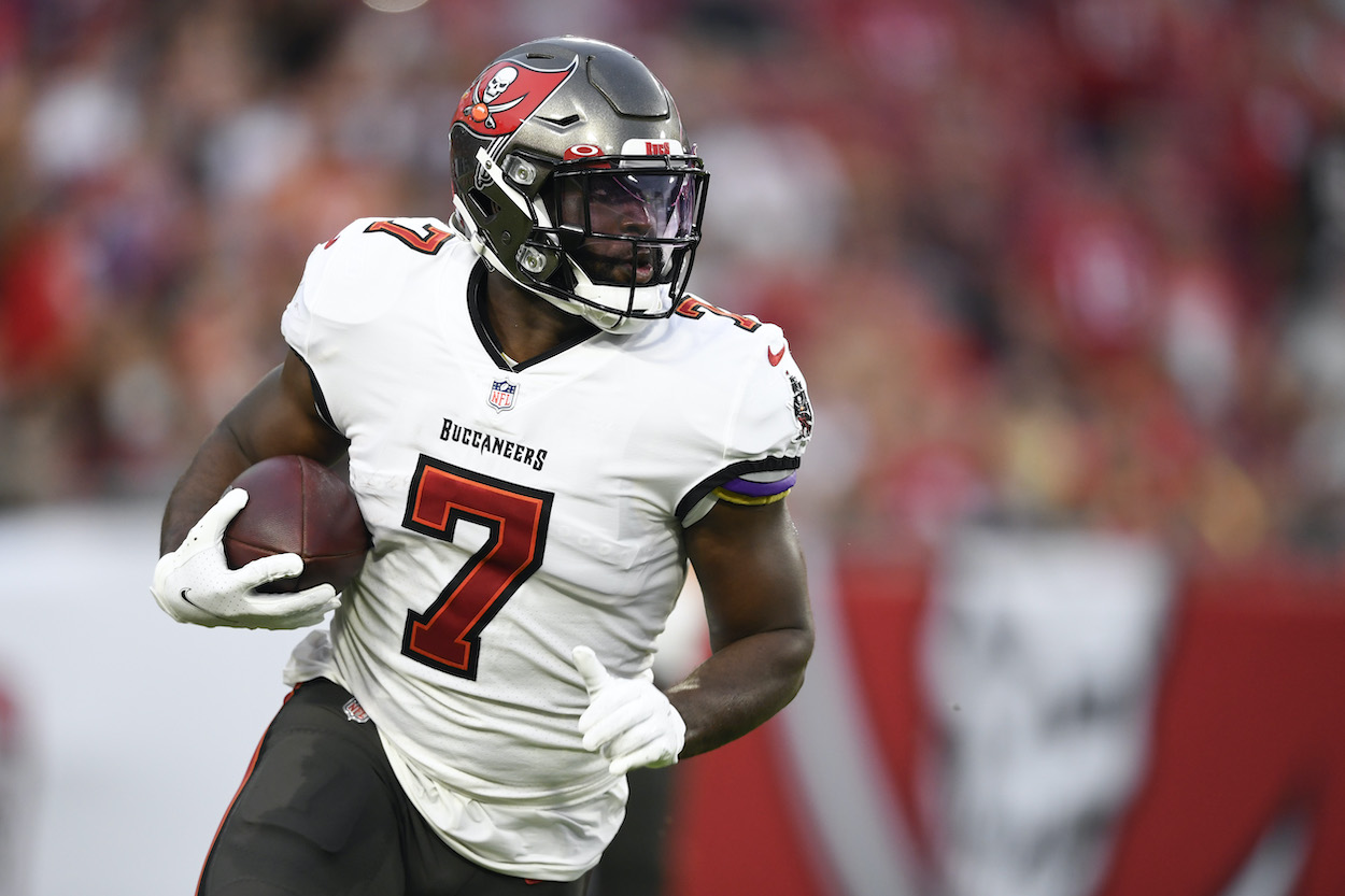 Leonard Fournette No. 7 of the Tampa Bay Buccaneers runs the ball during the first quarter against the Cincinnati Bengals during a preseason game at Raymond James Stadium on August 14, 2021 in Tampa, Florida.