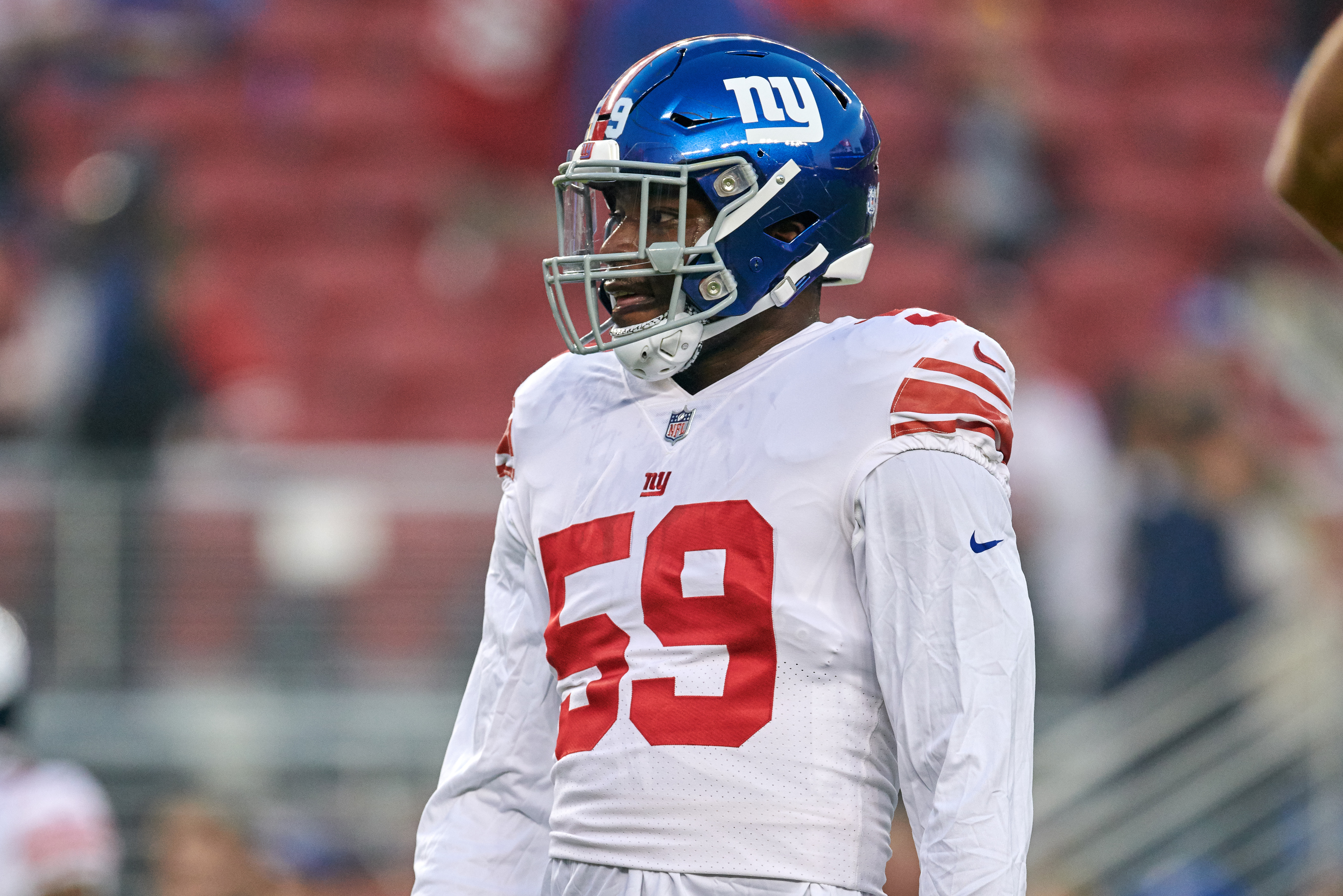 New York Giants linebacker Lorenzo Carter stands on the field during NFL game
