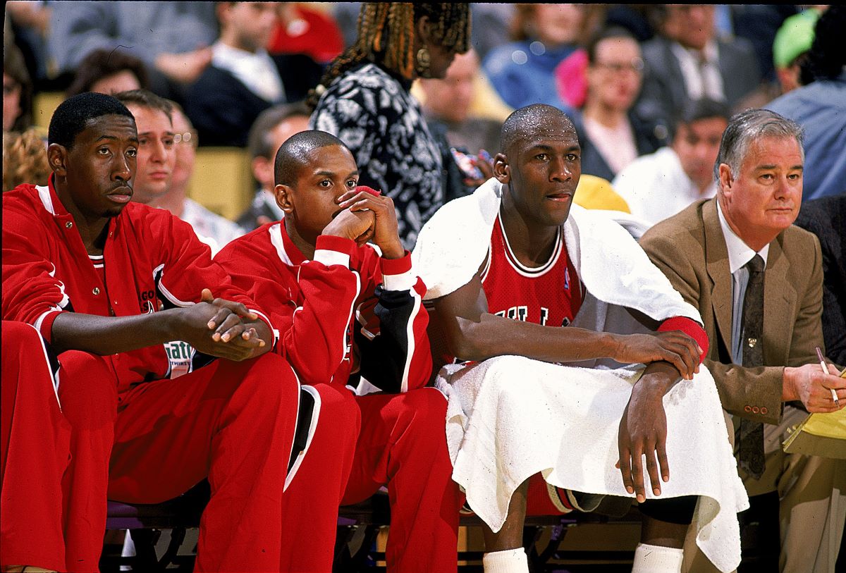 Michael Jordan sits on the bench.