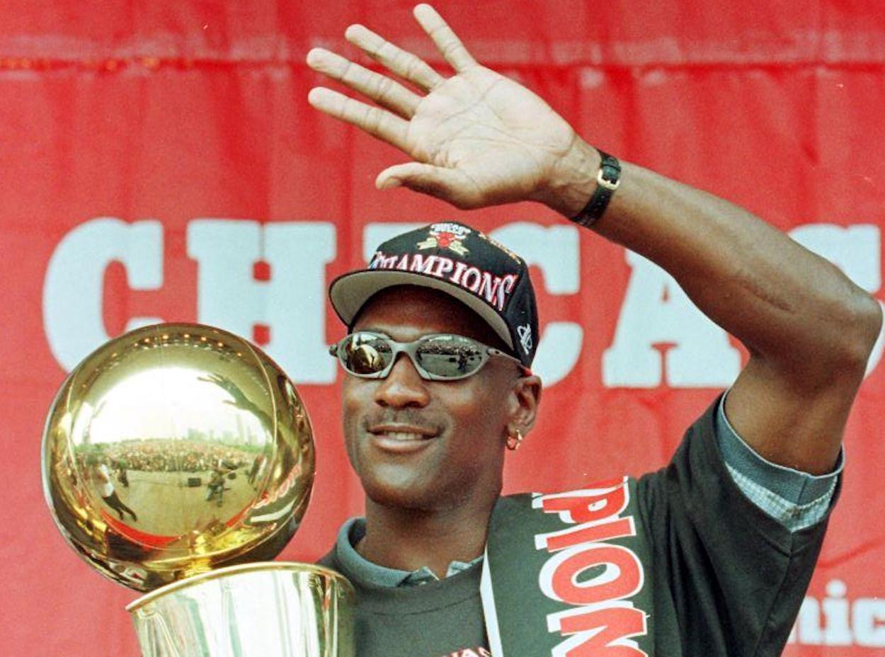 Michael Jordan waves to the crowd after winning one of his six NBA championships.