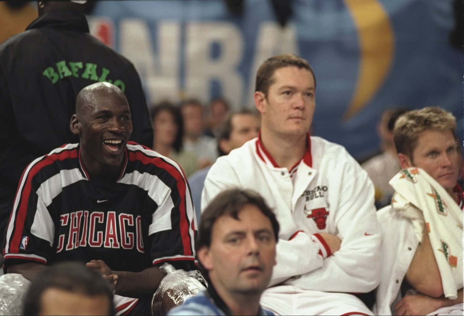 Michael Jordan (L) and Luc Longley (R) sit on the bench during a 1997 scrimmage.