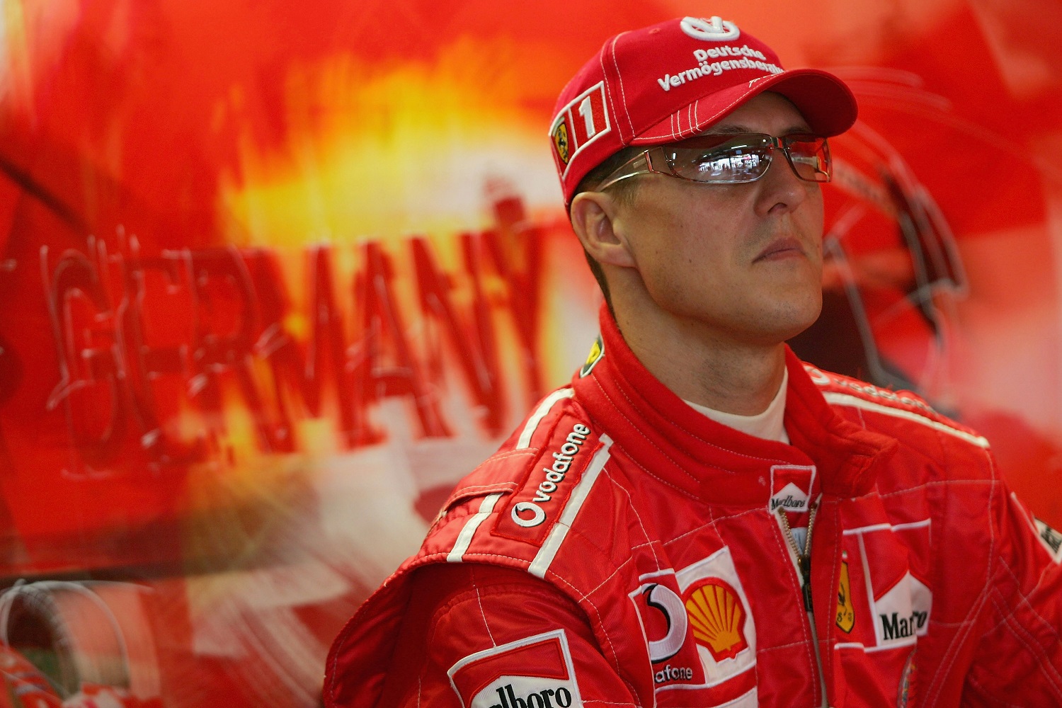 Michael Schumacher of Germany and Ferrari waits in the garage during the practice session for the German F1 Grand Prix at the Hockenheim Circuit on July 23, 2004, in Hockenheim, Germany.