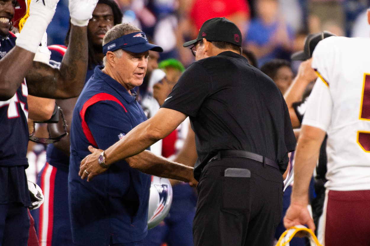 New England Patriots head coach Bill Belichick shakes the hand of Washington Football Team head coach Ron Rivera.