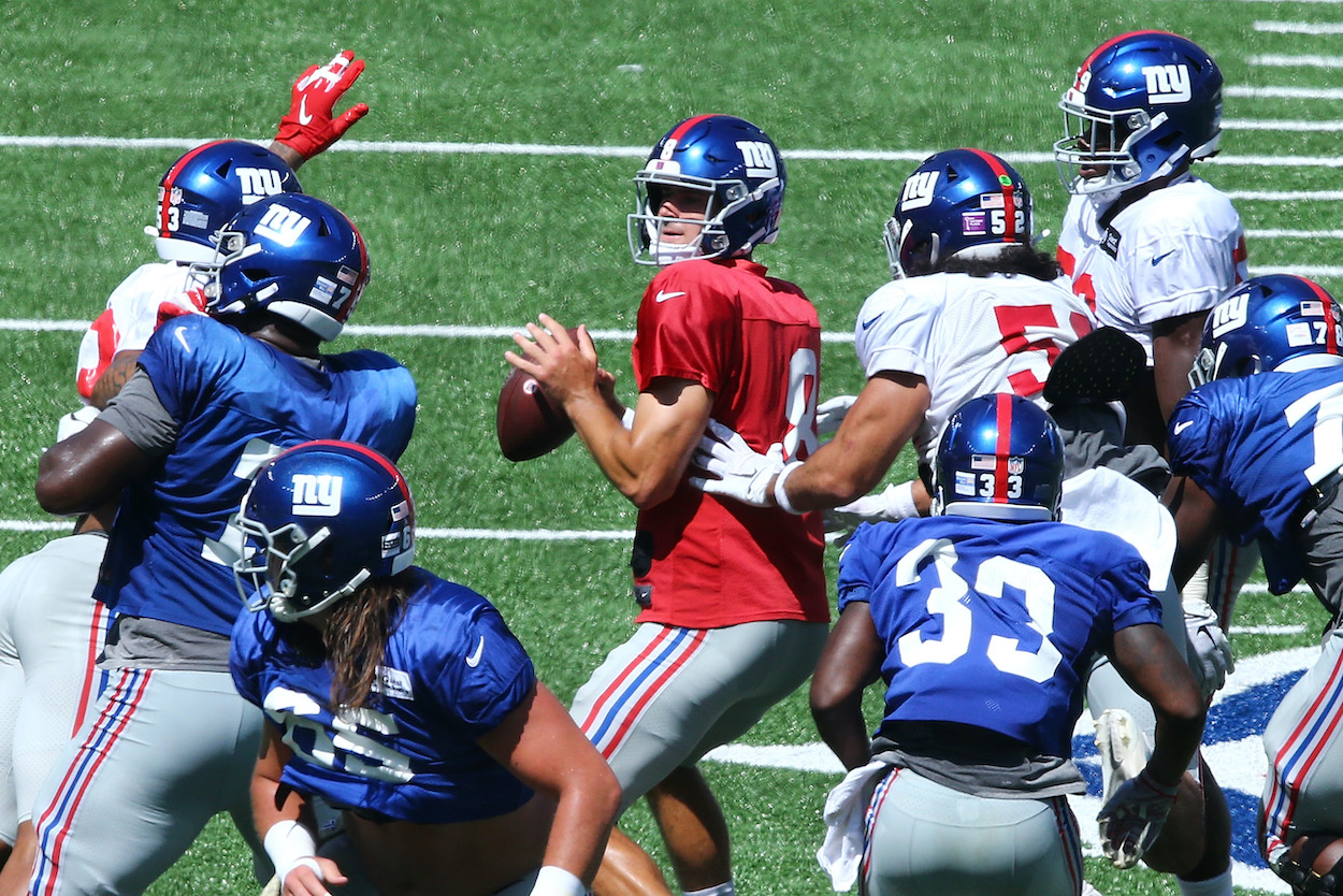 Daniel Jones of the New York Giants looks to pass the ball during the Blue and White scrimmage at MetLife Stadium on September 03, 2020 in East Rutherford, New Jersey. During a 2021 training camp session, the QB got caught up in a wild New York Giants brawl.
