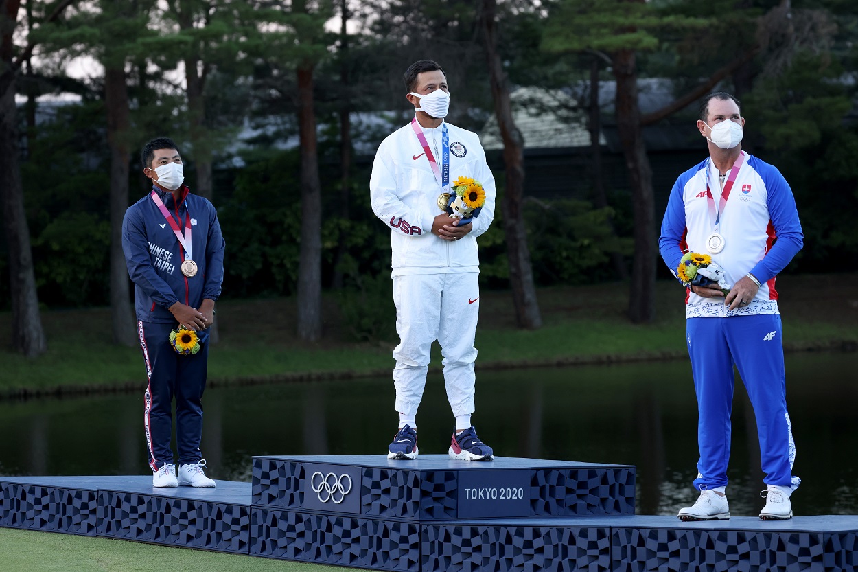 Xander Schauffele, Rory Sabbatini, and C.T. Pan on the medal stand at the Tokyo Olympics