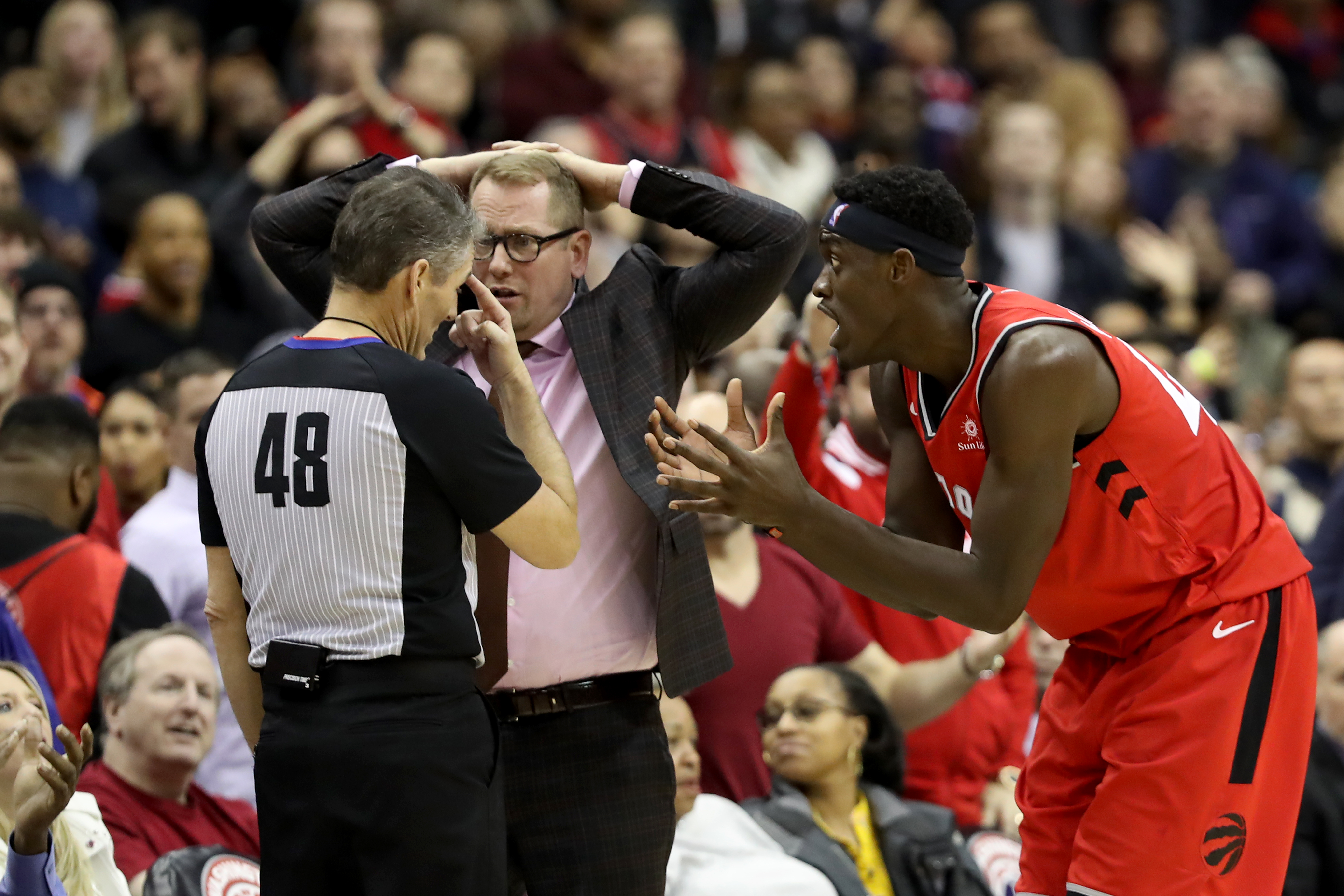 Pascal Siakam and Nick Nurse argue with an official during a Raptors game in 2019