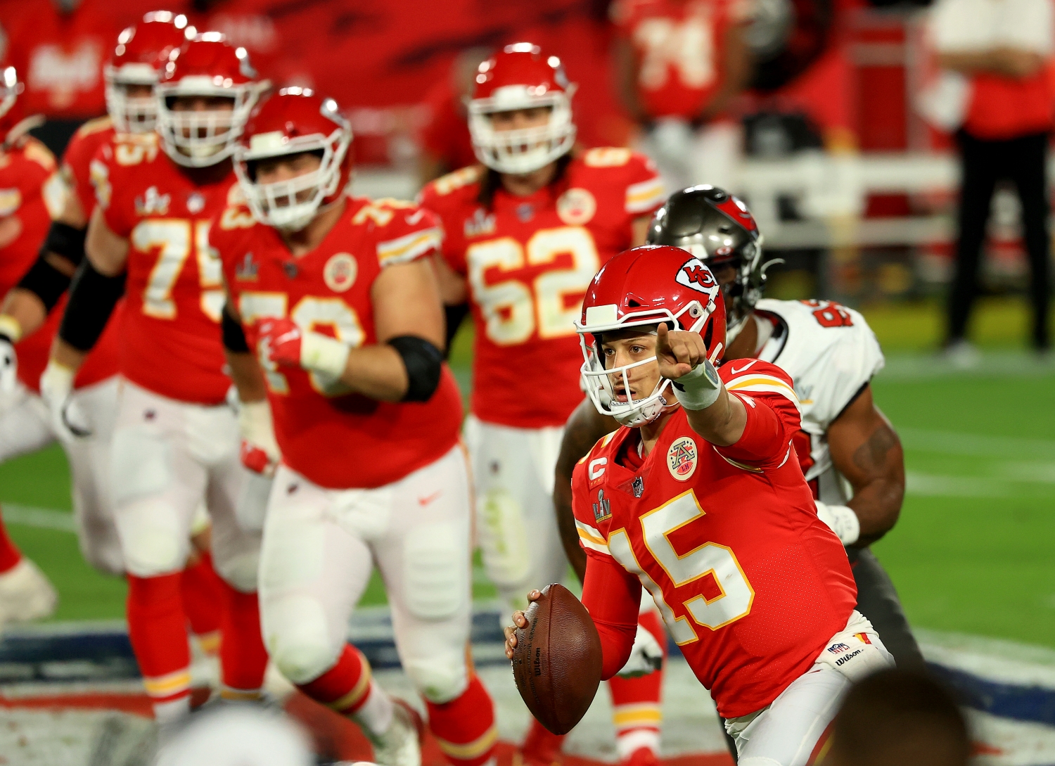 Kansas City Chiefs quarterback Patrick Mahomes signals to a teammate during Super Bowl 55.