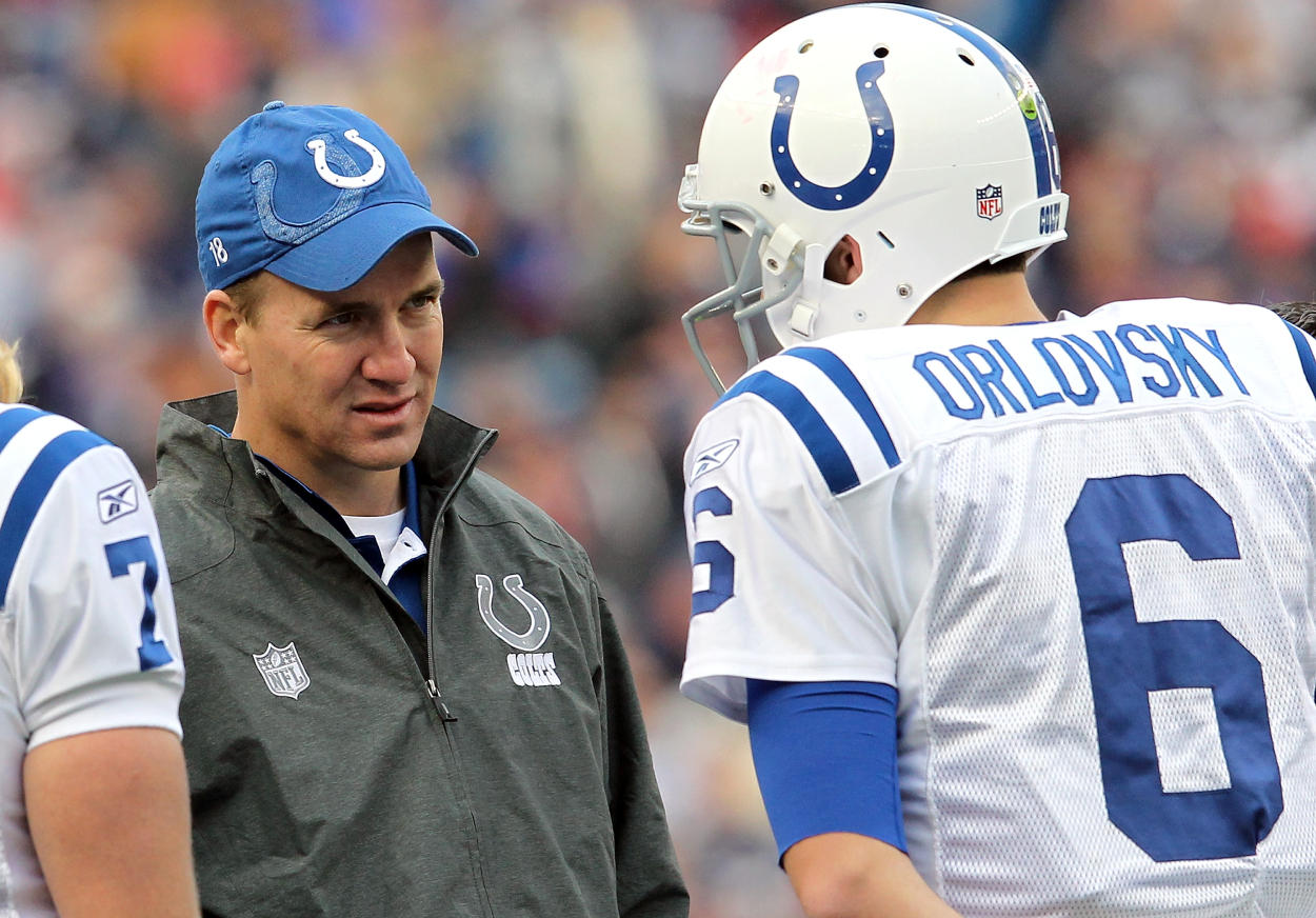 Former Indianapolis Colts quarterback Peyton Manning talking to Dan Orlovsky in 2011.