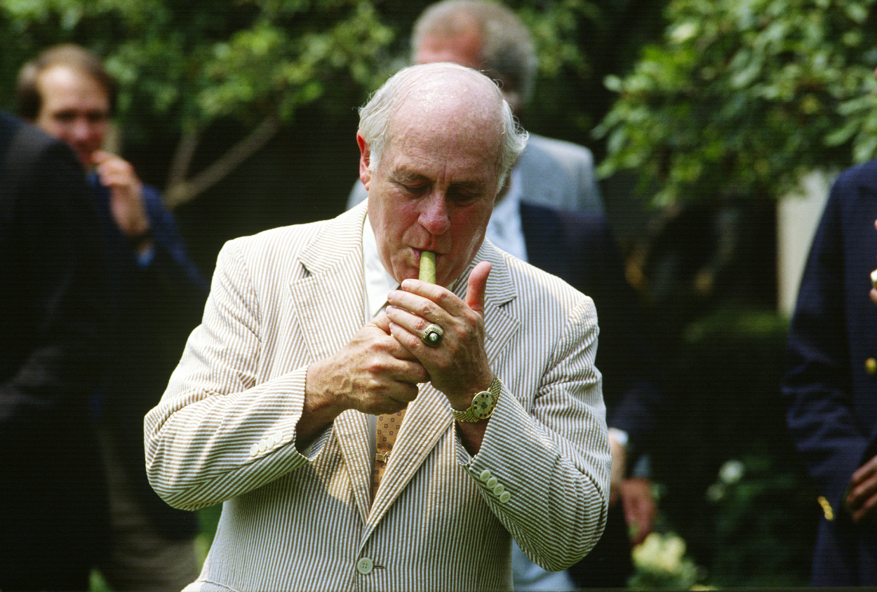 Why Did Red Auerbach Smoke All Those Cigars and Hold a RolledUp Game
