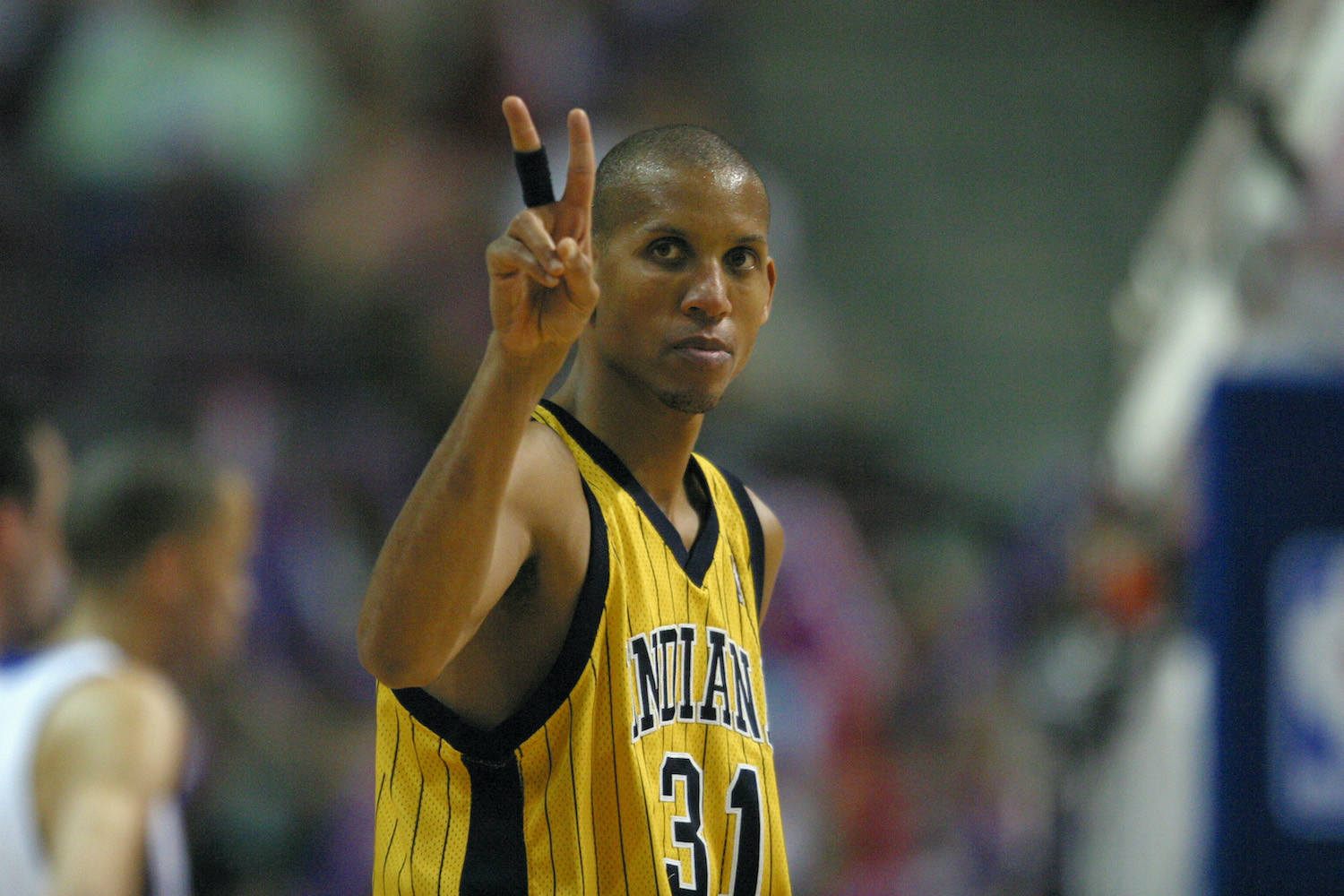 Indiana Pacers guard Reggie Miller gestures during an NBA game.