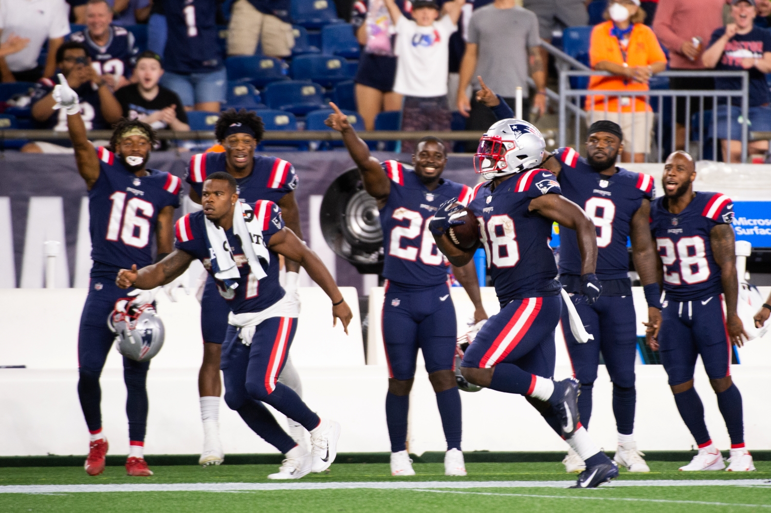 New England Patriots running back Rhamondre Stevenson runs for a touchdown during his first preseason game.