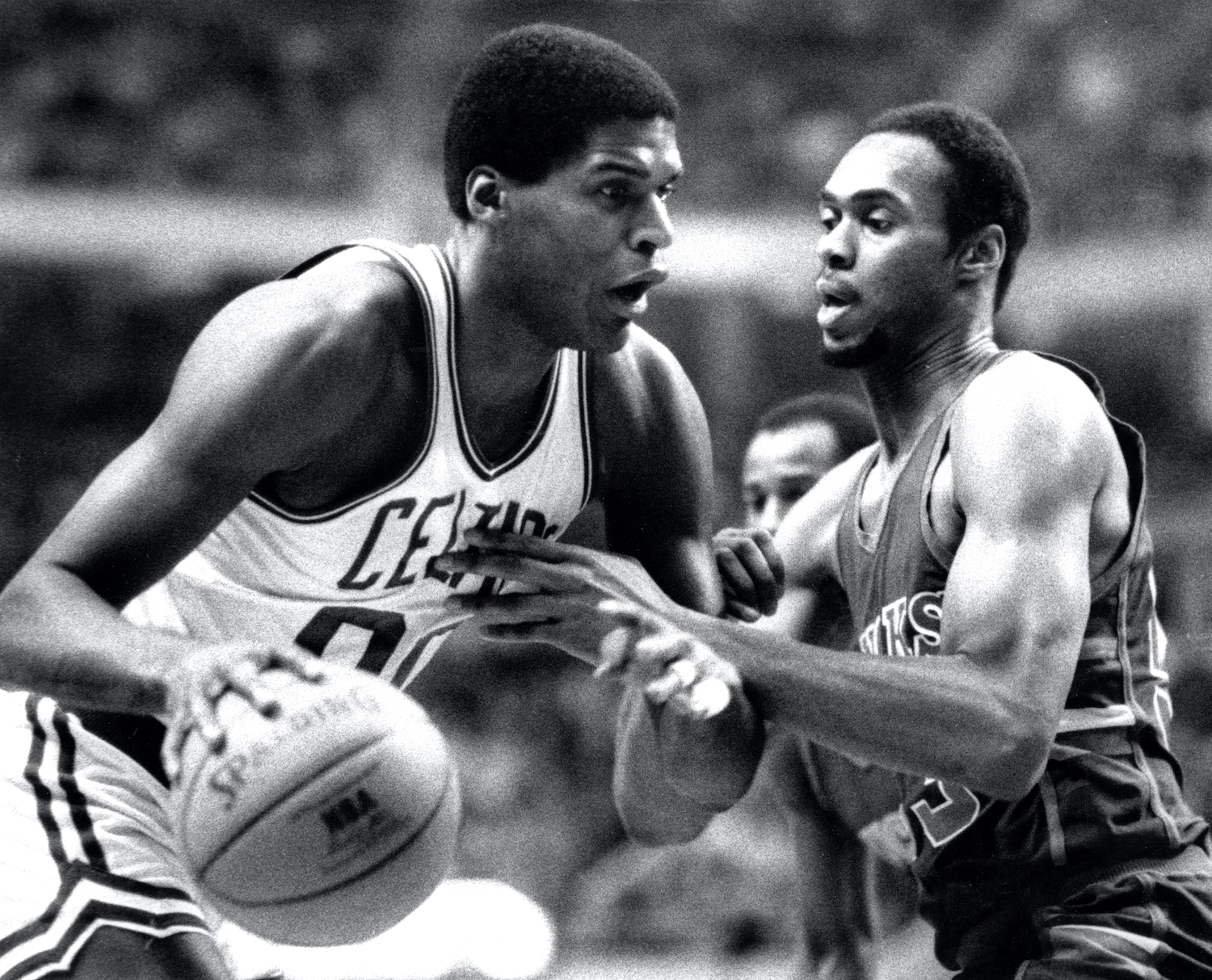 Boston Celtics big man Robert Parish dribbles the ball during a 1984 NBA game.