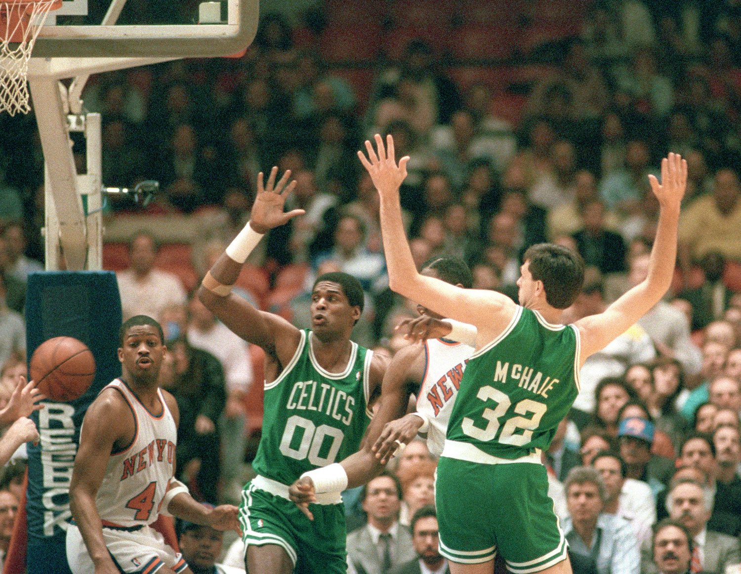 Boston Celtics stars Robert Parish (L) and Kevin McHale (R) play defense in 1988.