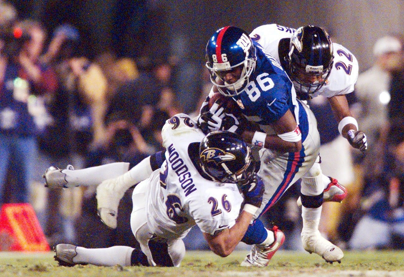 Baltimore Ravens safety Rod Woodson makes a tackle in the Super Bowl