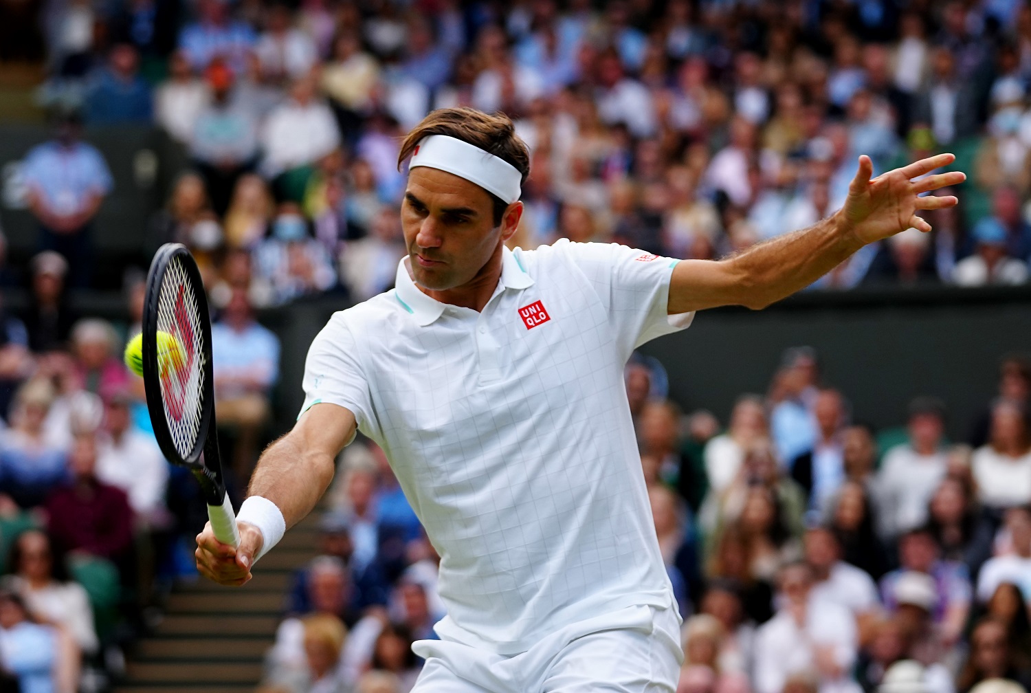 Roger Federer of Switzerland plays a backhand during his men's singles quarterfinal match against Hubert Hurkacz of Poland at on July 7, 2021.