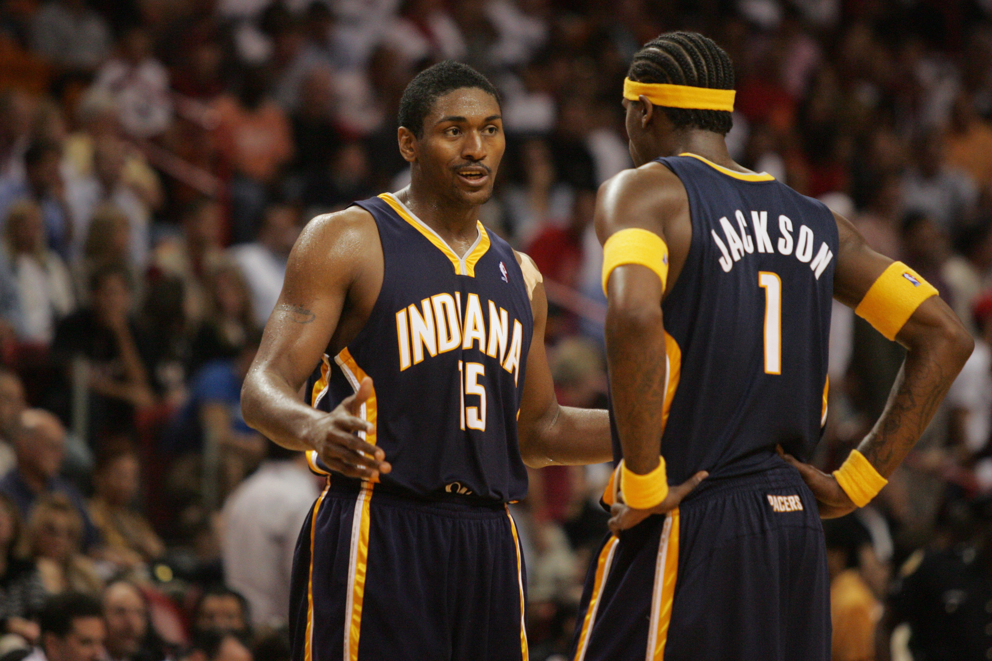 Metta Sandiford-Artest and Stephen Jackson talk during an NBA game