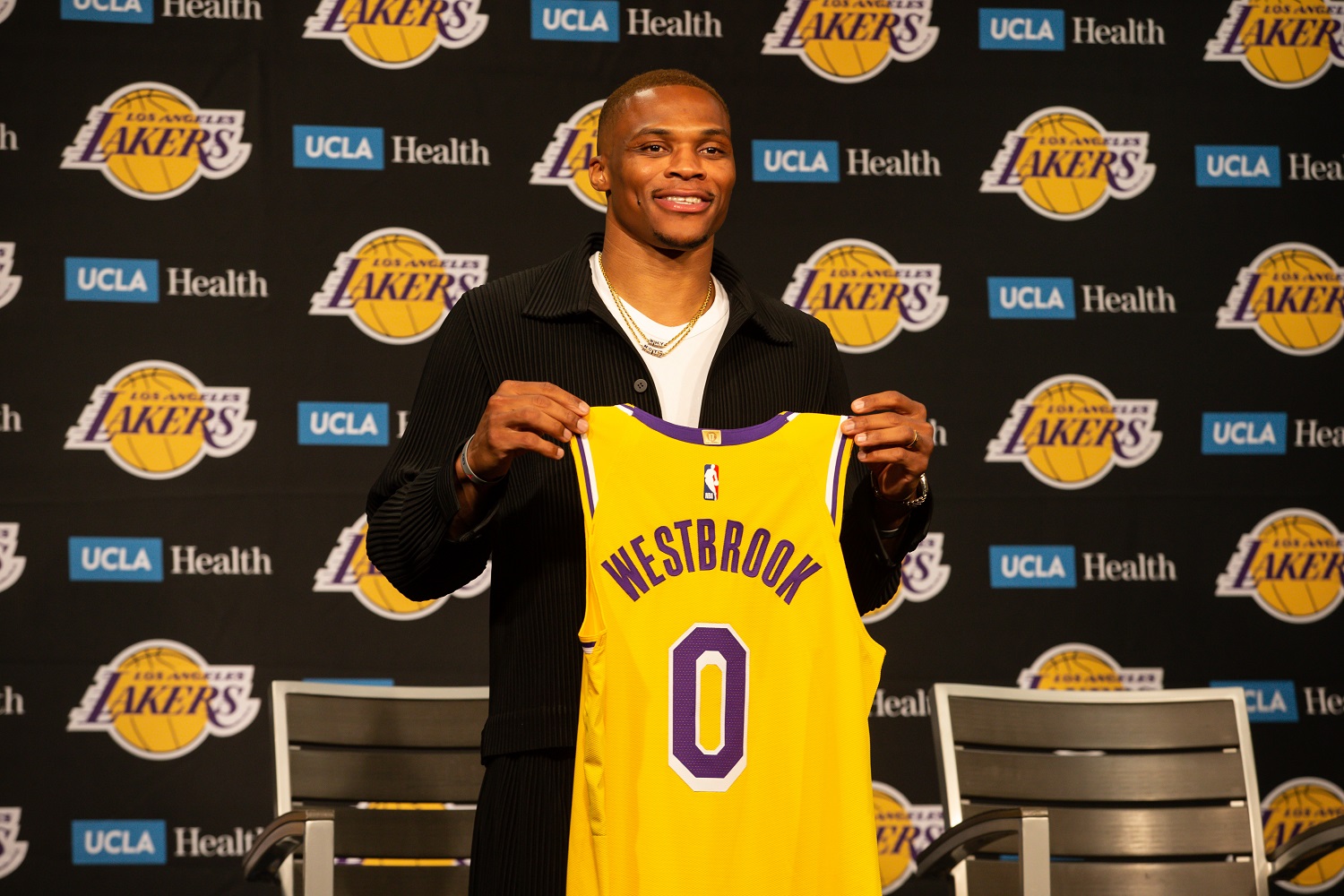 Russell Westbrook poses with his jersey during the Los Angeles Lakers' Introductory news conference for Russell Westbrook on Aug. 10, 2021.