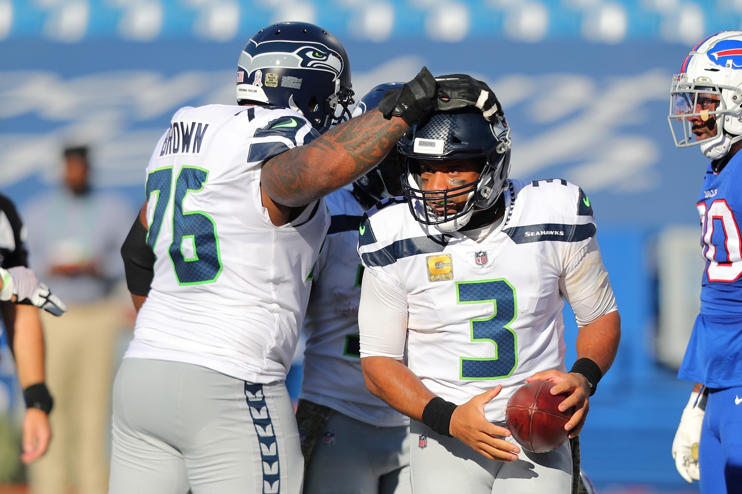 Seattle Seahawks left tackle Duane Brown congratulates Russell Wilson after a touchdown.