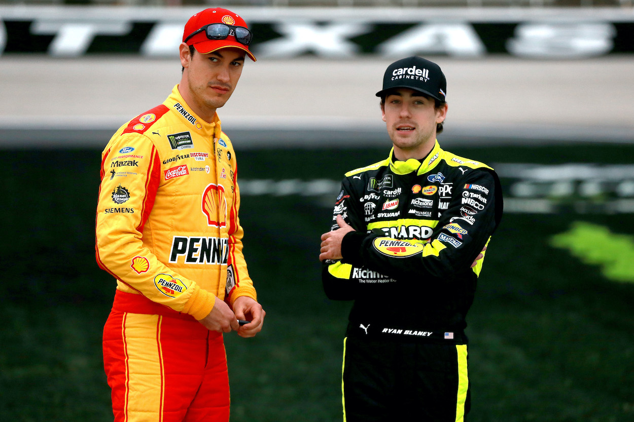 Joey Logano and Ryan Blaney stand on grid before race at Texas