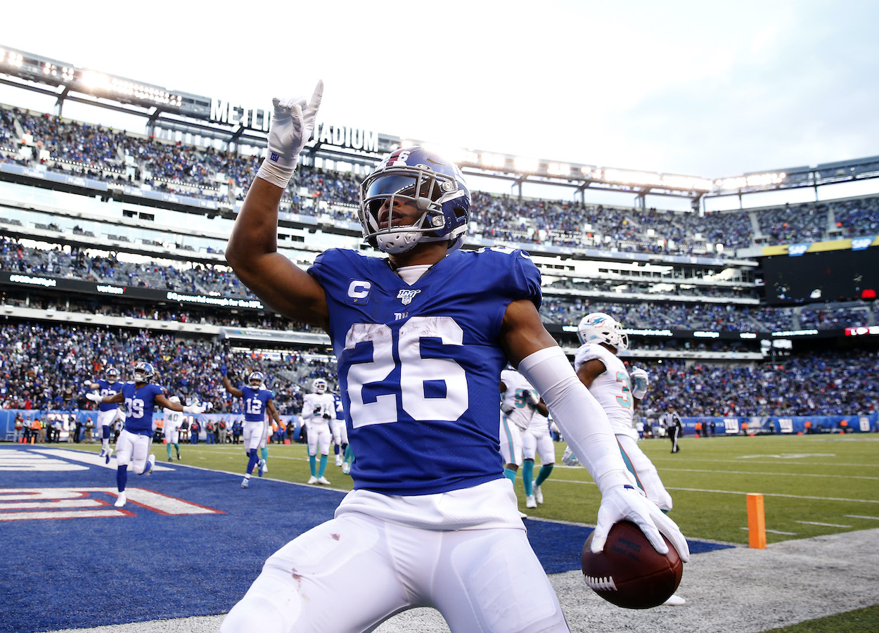 Saquon Barkley of the New York Giants celebrates his touchdown in the fourth quarter against the Miami Dolphins at MetLife Stadium on December 15, 2019 in East Rutherford, New Jersey.The New York Giants defeated the Miami Dolphins 31-13.