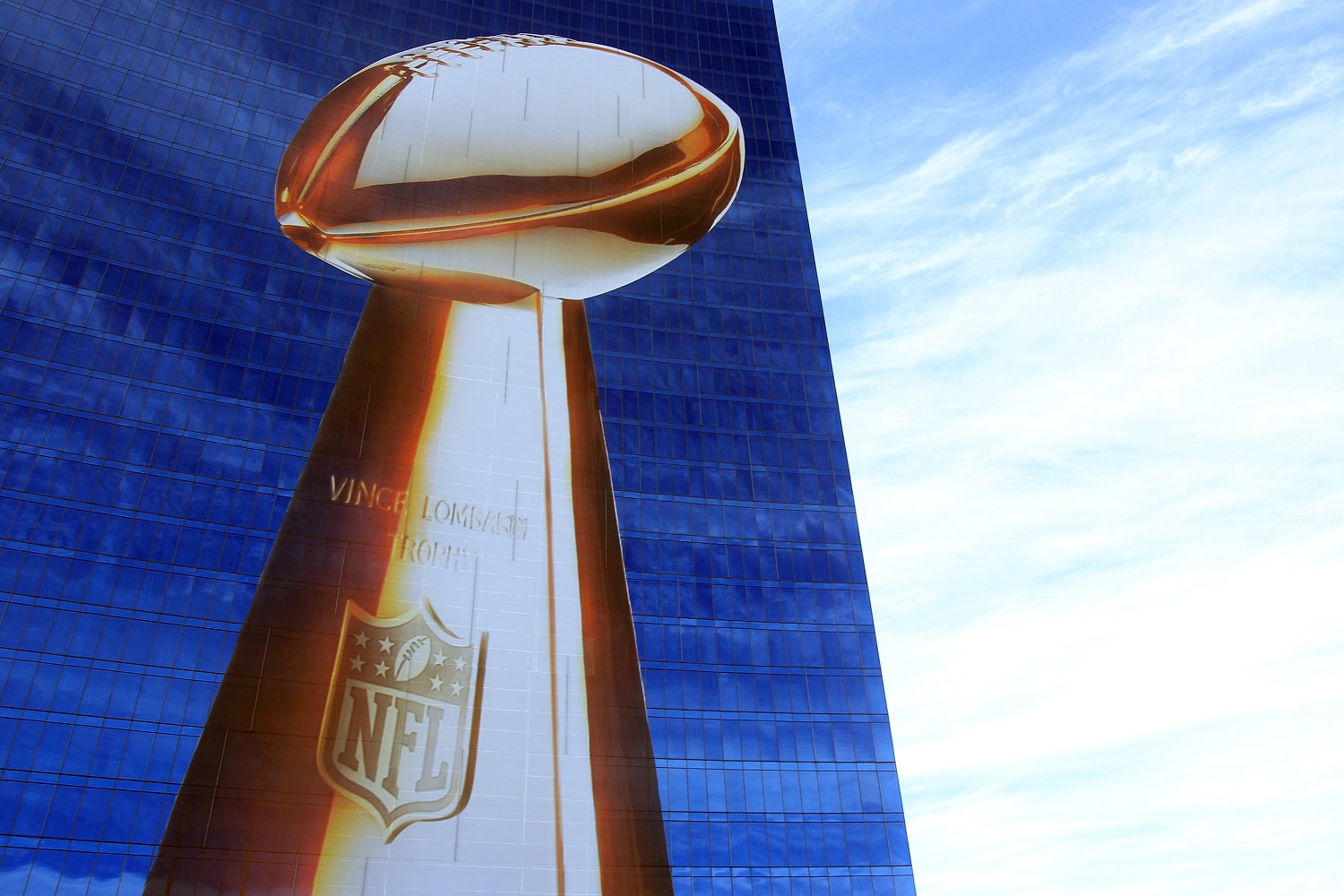 Official signage of the Lombardi Trophy and Super Bowl XLVI is seen on the exterior of the J.W. Marriott Indianapolis.