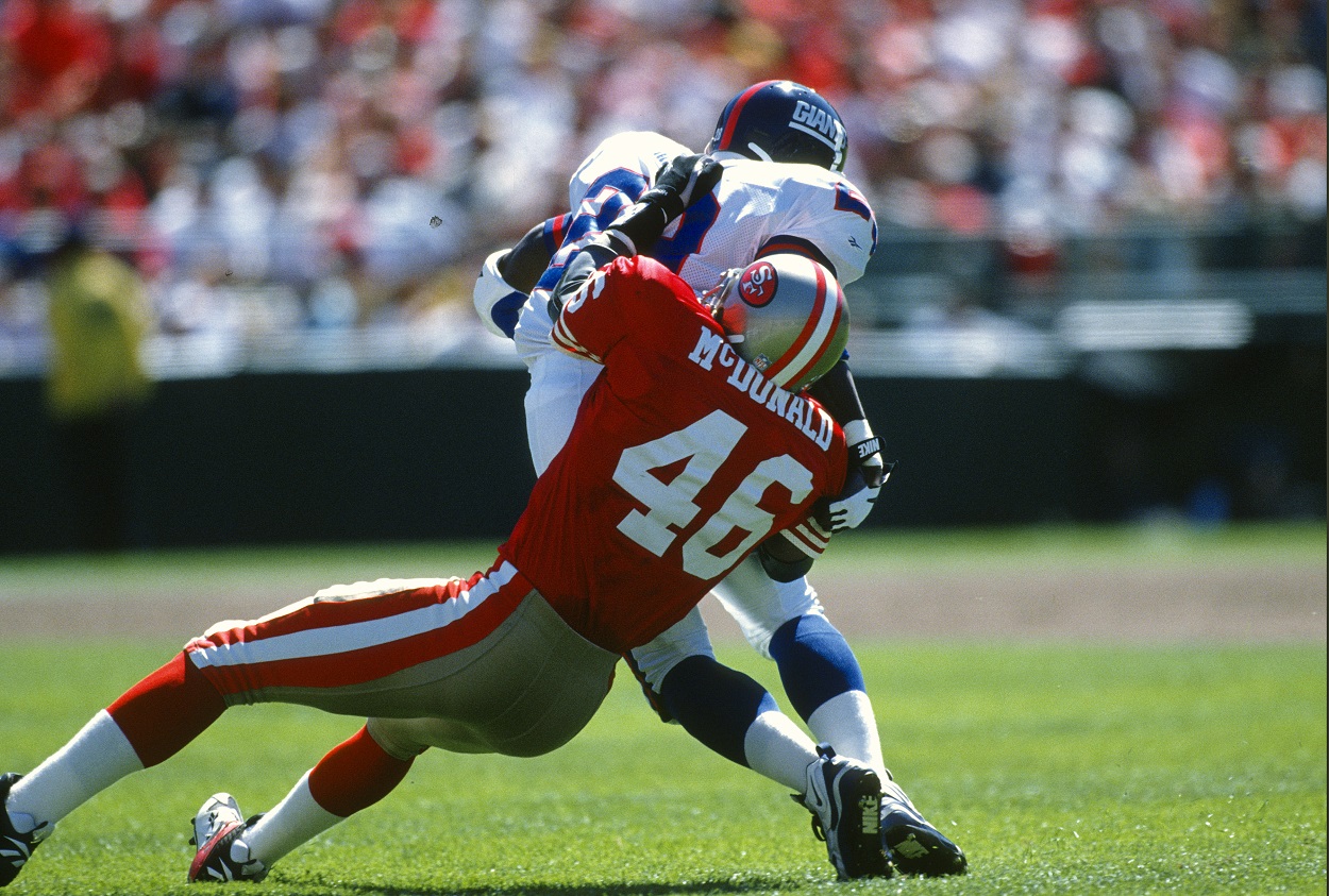 Tim McDonald makes a tackle during a 49ers-Giants matchup in October 1995