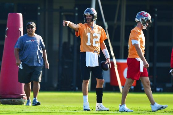 Tom Brady of the Tampa Bay Buccaneers gestures to O.J. Howard (not pictured) during training camp at AdventHealth Training Center on July 25, 2021 in Tampa, Florida.