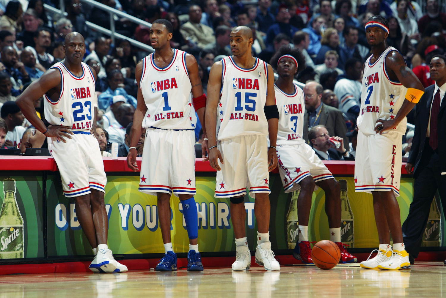 Michael Jordan and Vince Carter stand together as members of the 2003 NBA Eastern Conference All-Star team.