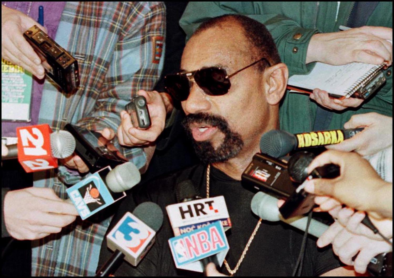 NBA legend Wilt Chamberlain speaks to reporters in 1997.